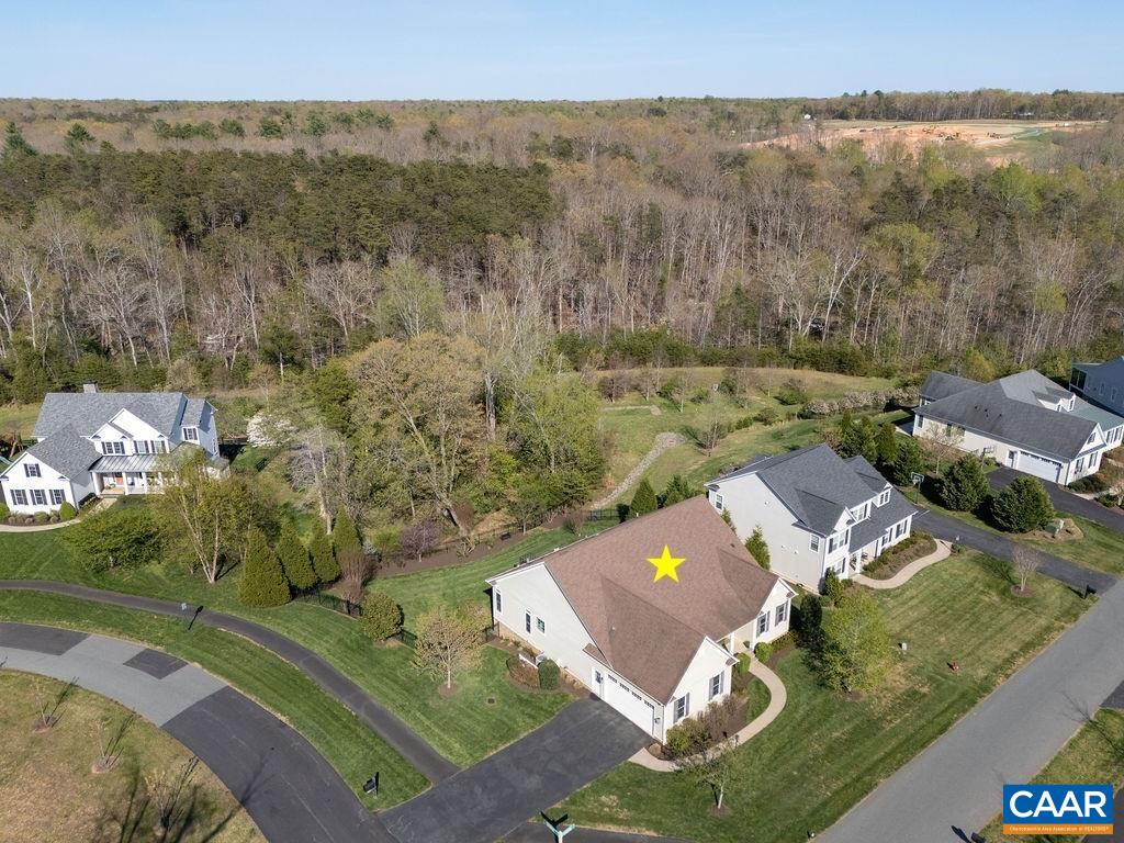 The home also backs to community common space and a large wooded tract beyond creating nice privacy.