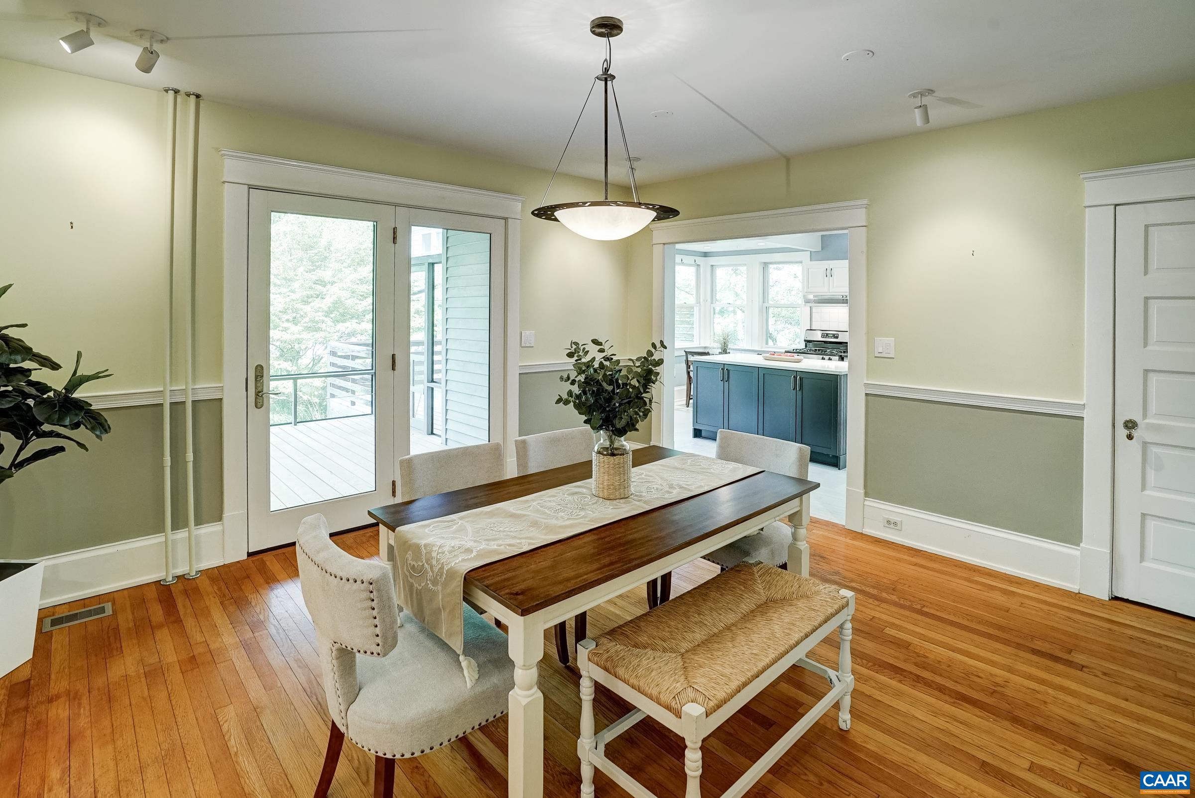 Dining room with contrasting paint and chair rail.