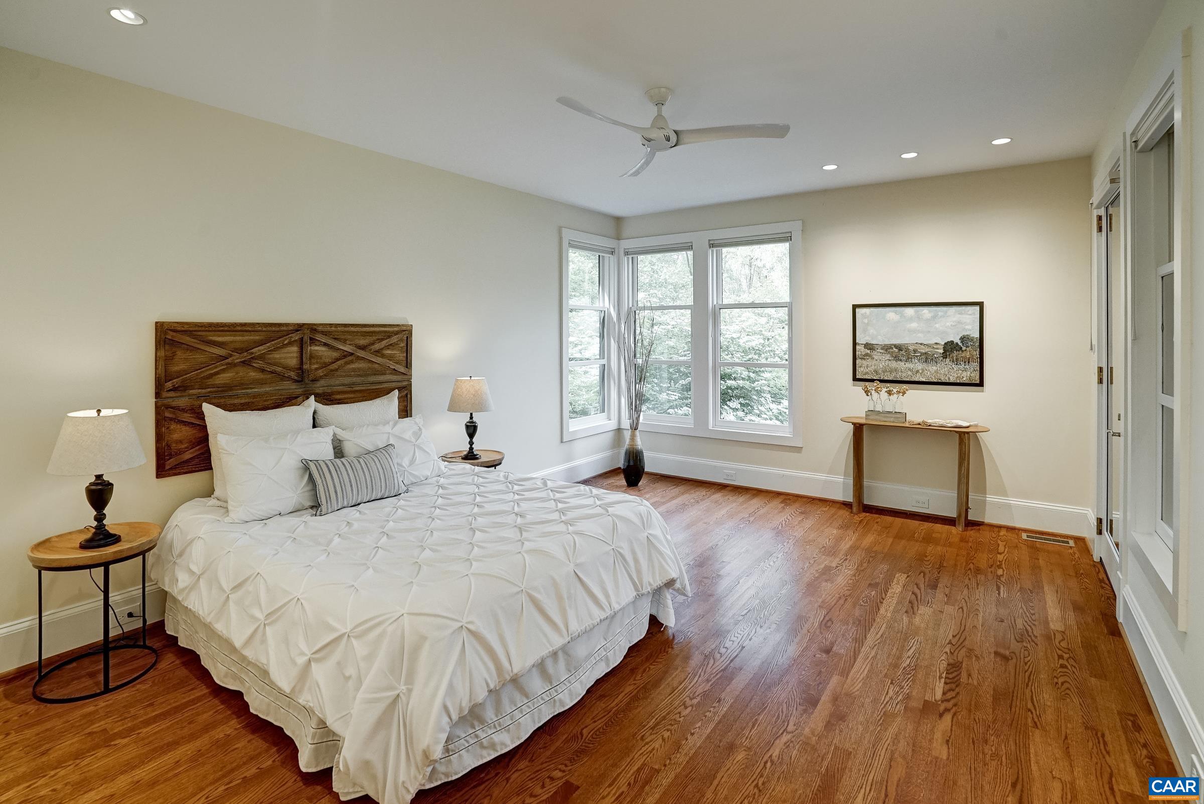 New primary suite with access to screened porch.