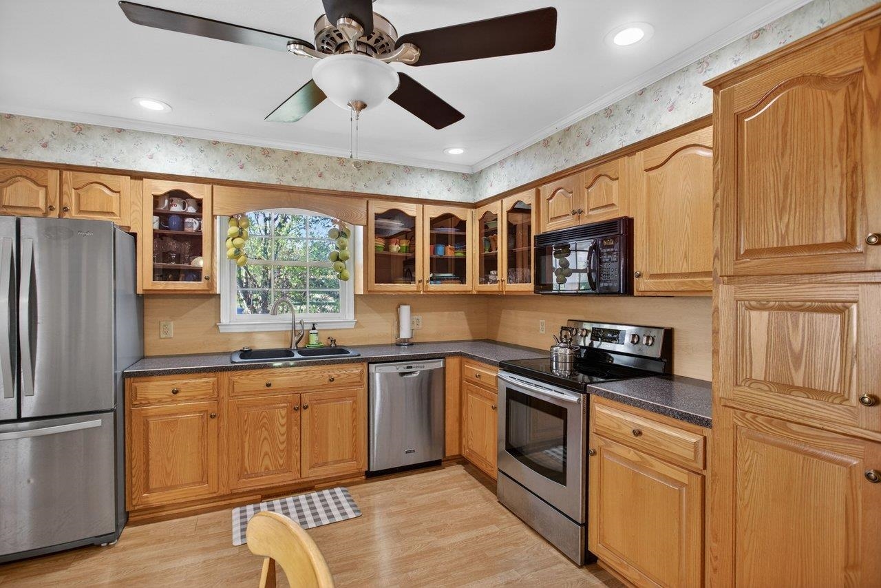 Updated stainless steel appliances including range, refrigerator, microwave and dishwasher