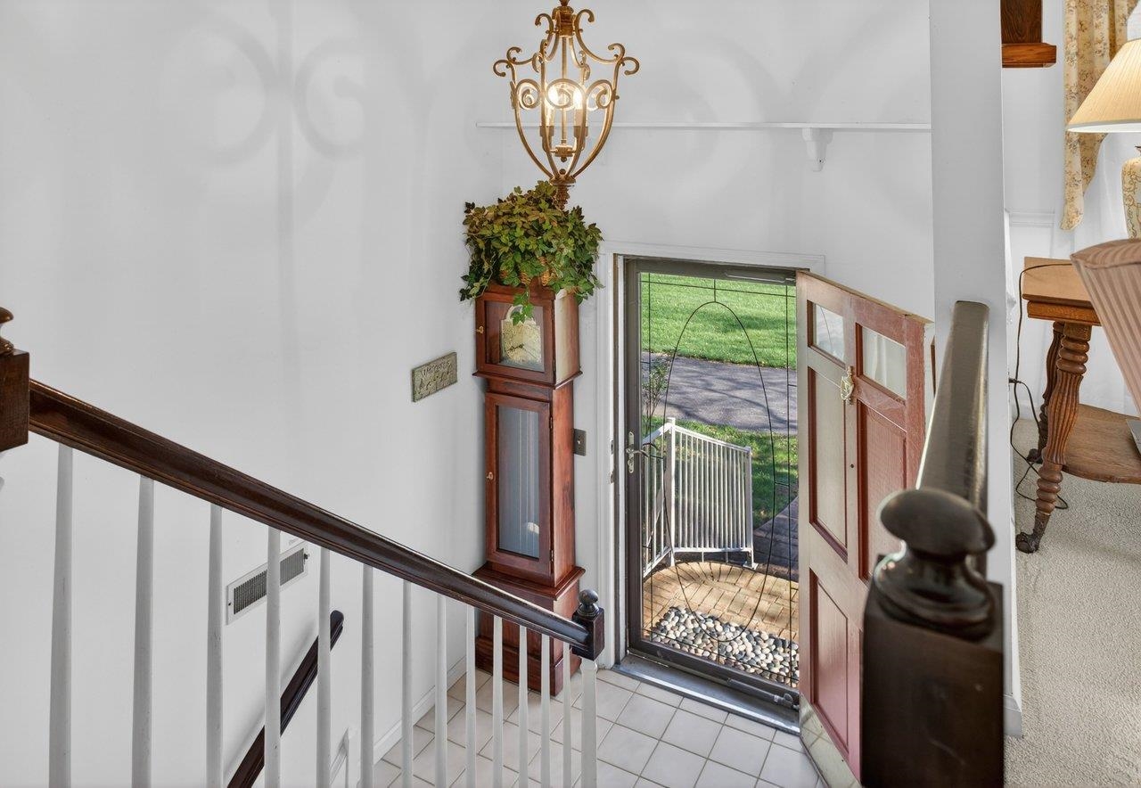 Steps lead up to the main level of this well maintained home