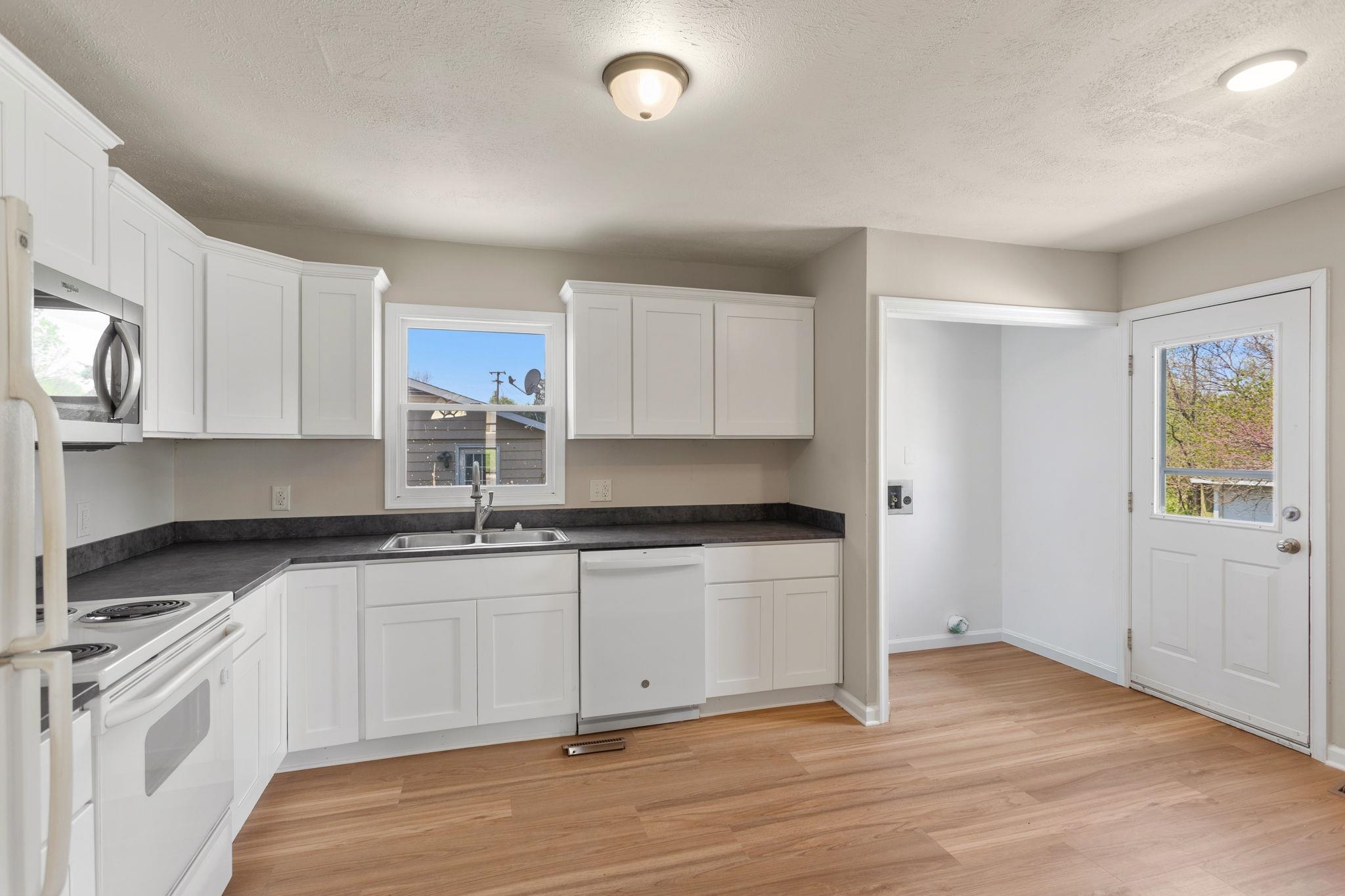 and door goes to parking and back deck.