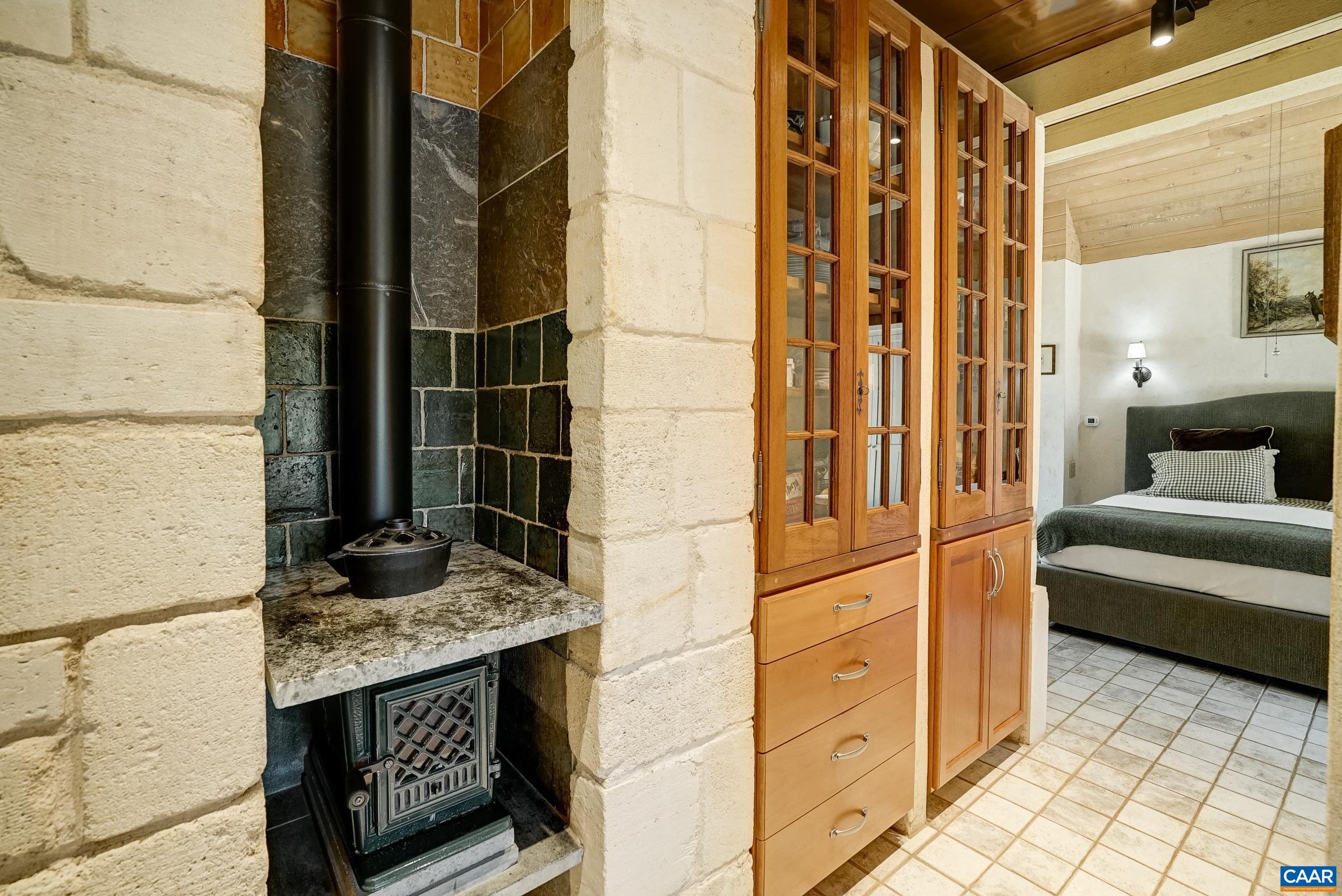 Built-in storage and wood burning stove.