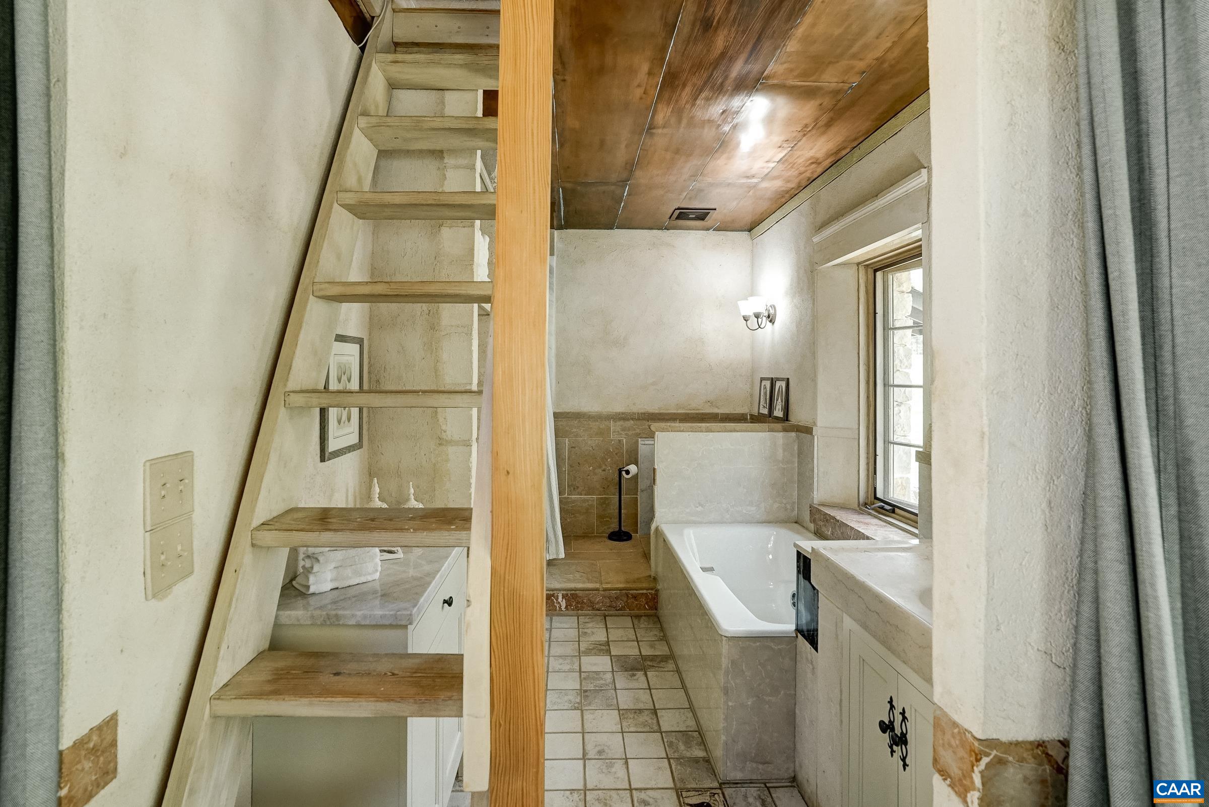 Spa like primary bathroom with marble details throughout.
