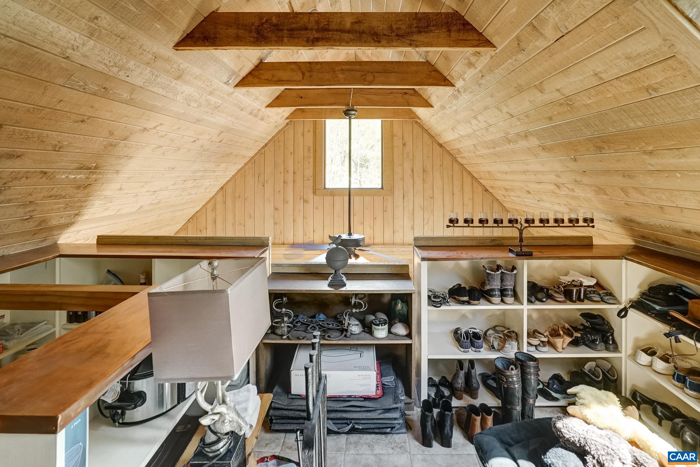 Ships ladder leads to lofted storage space, or make this a home office or reading nook.