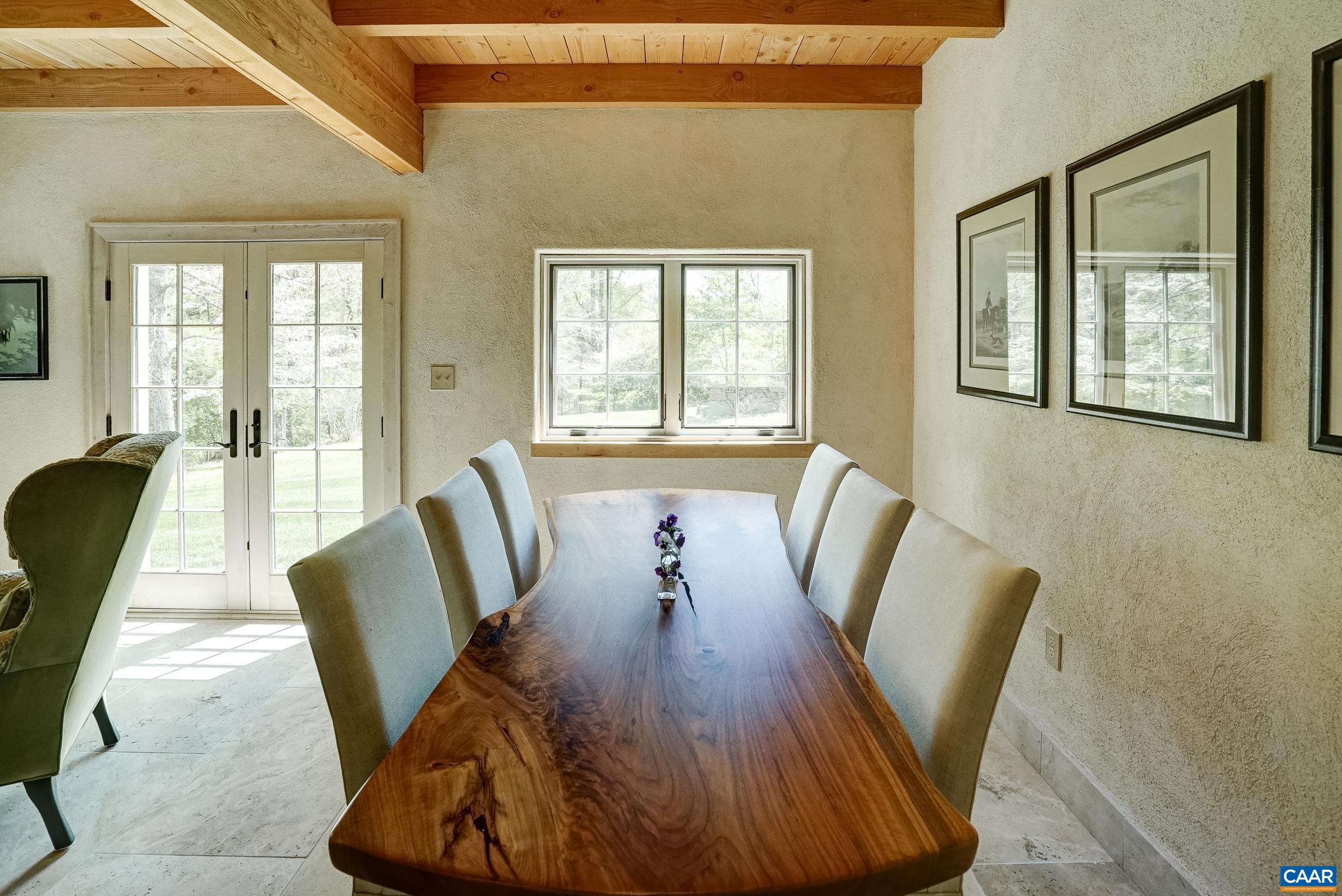 Open great room features a dining area that opens to a large living room.