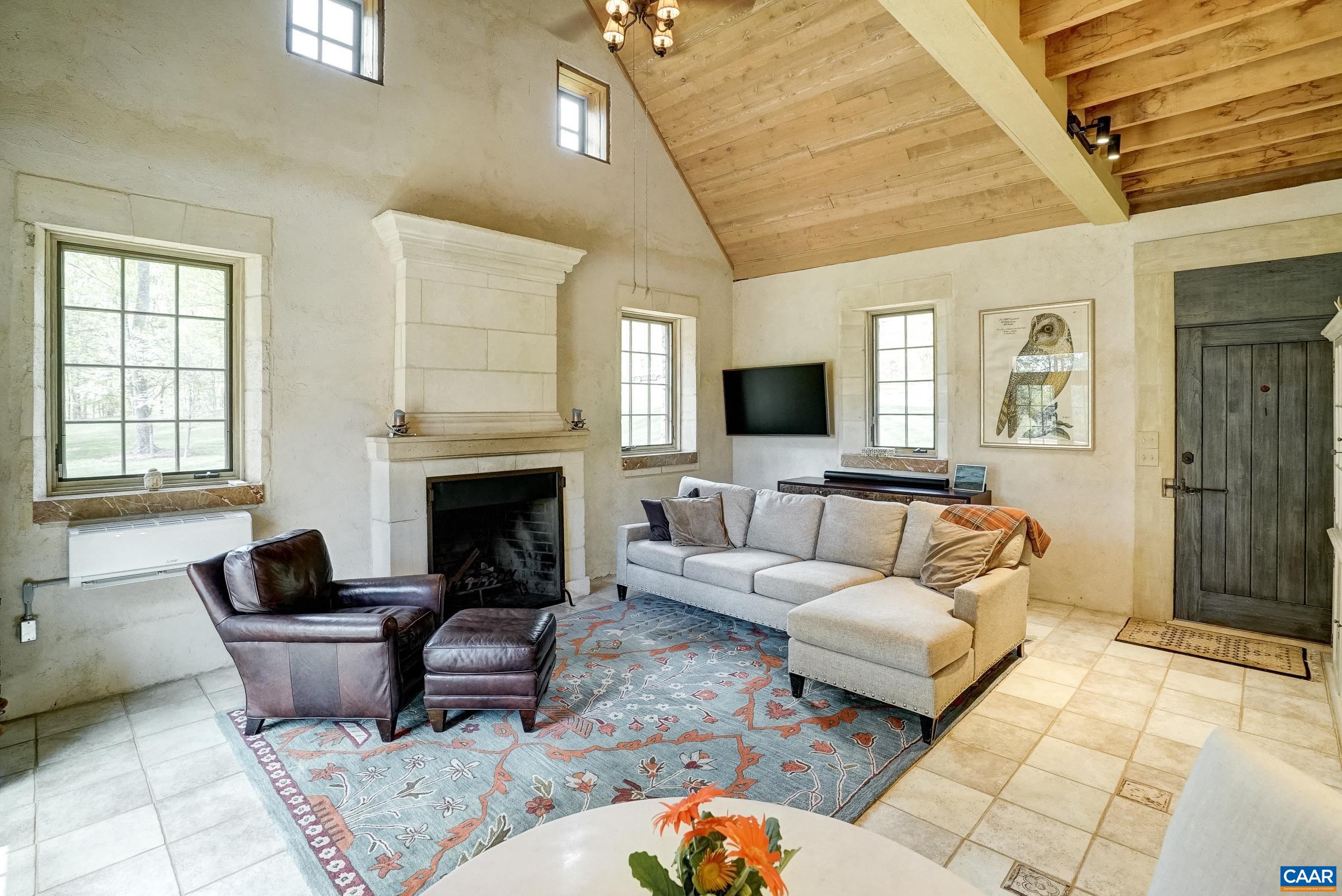 Tongue and groove exposed ceiling and timber beams.