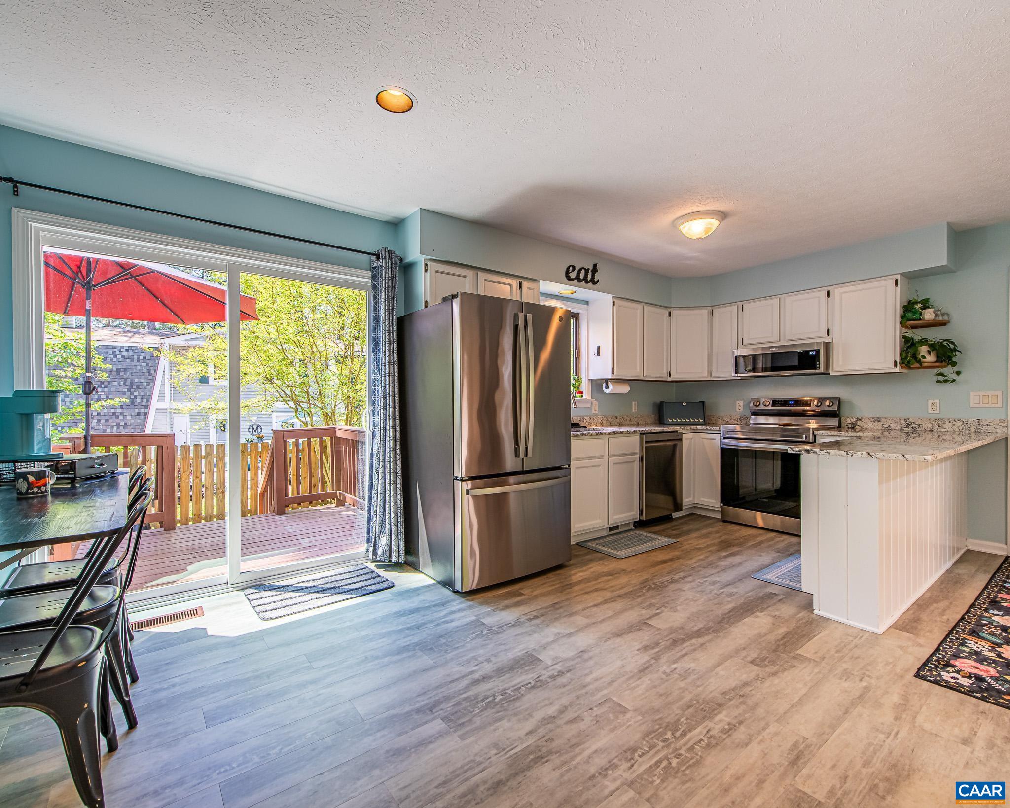 Access to freshly redone & painted Deck - leading to Rear Yard