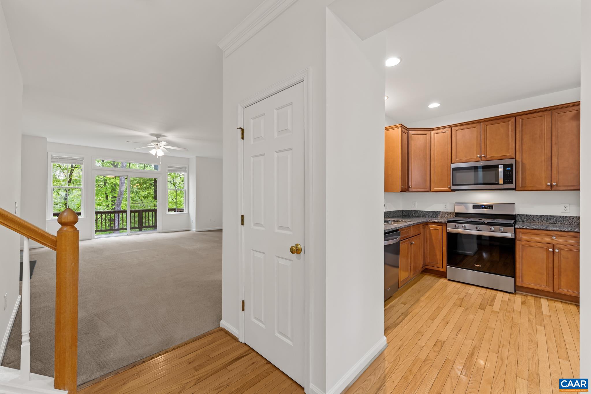 Bright eat-in kitchen with a pantry, granite tops and newer stainless appliances.