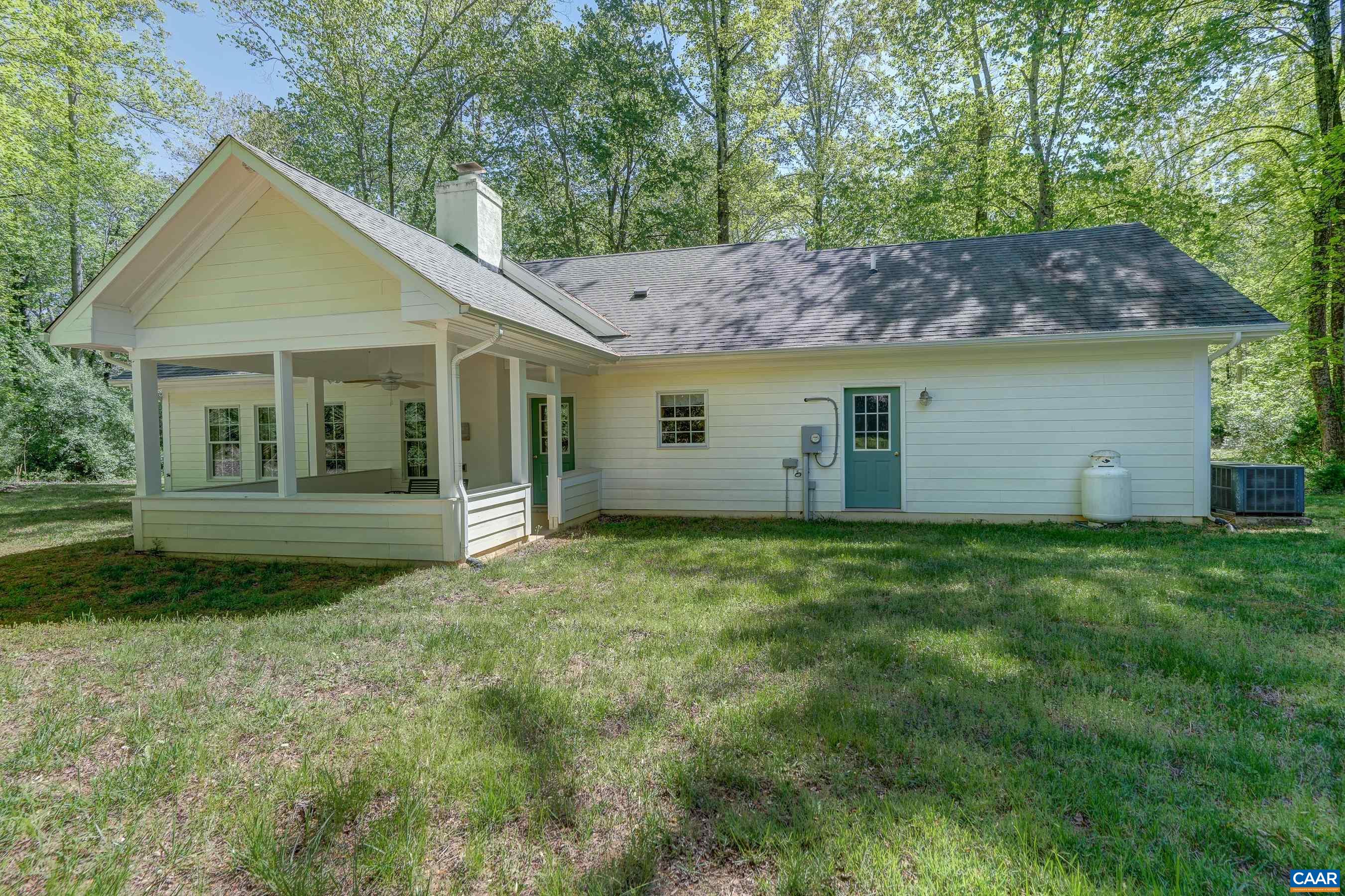 Set on 1.6 acres with a beautiful covered porch on which to watch nature in your own backyard.