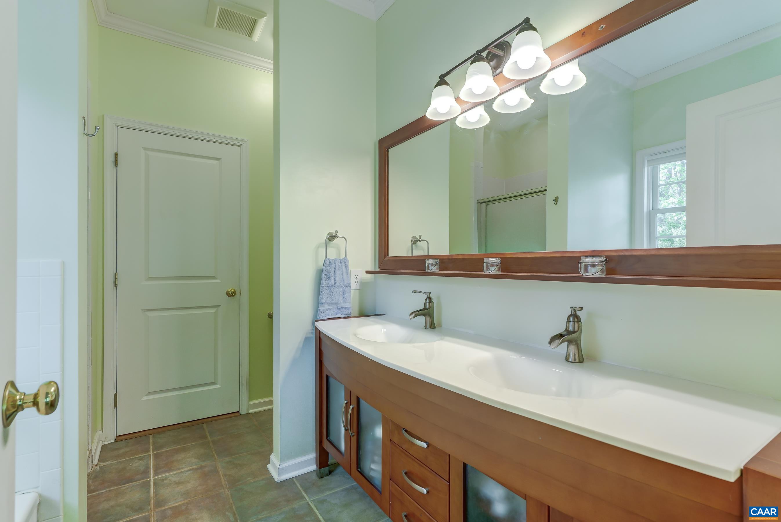Primary bathroom features double sink vanity.