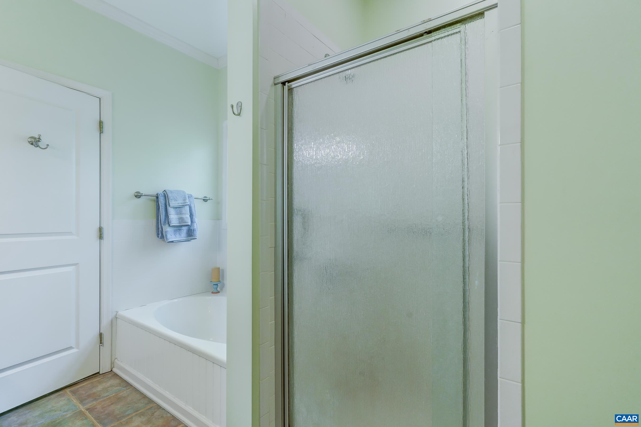 Soaking tub and separate shower.