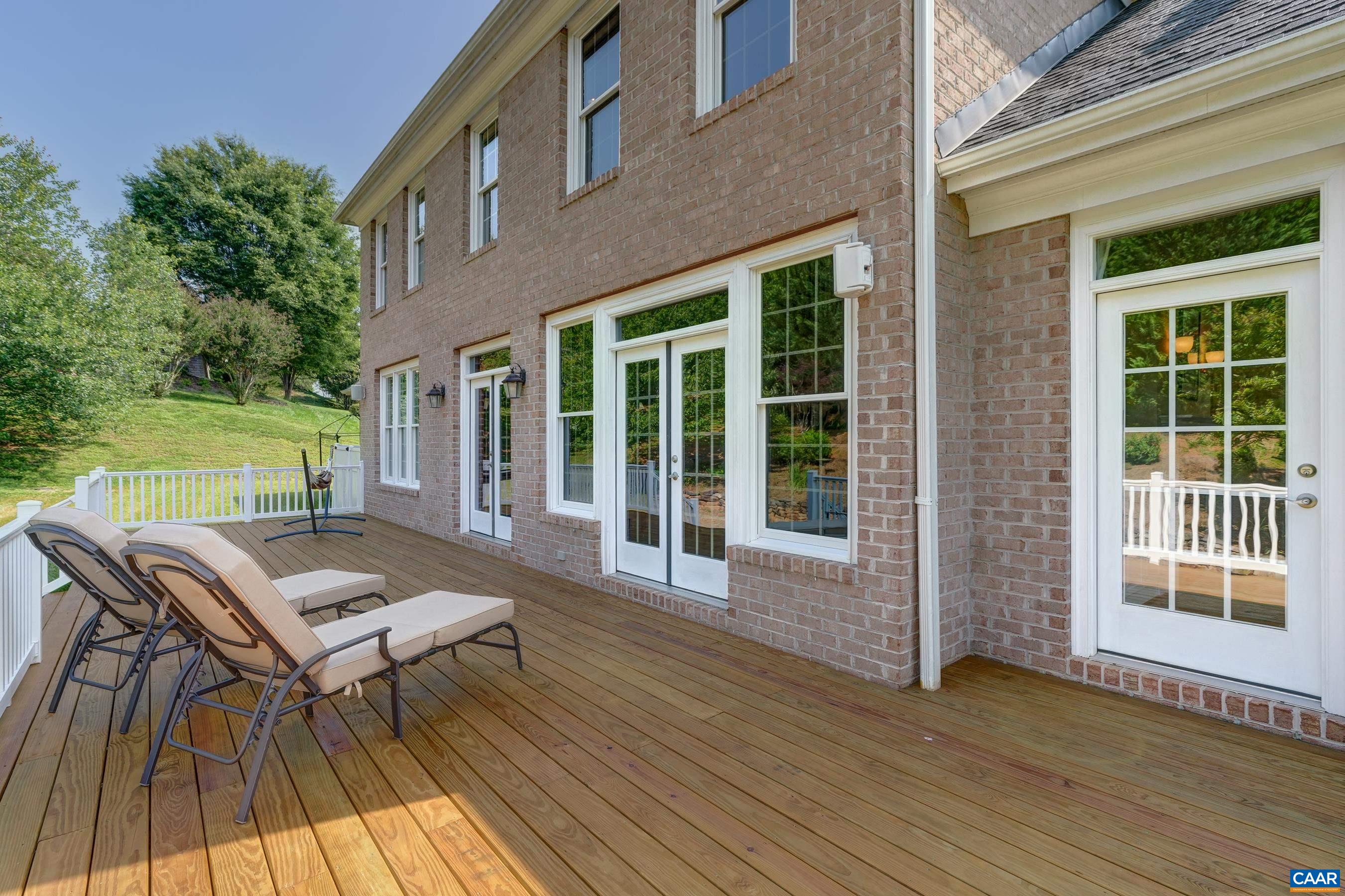 Beautiful deck at the rear of the home with access from the primary bedroom, great room and kitchen.