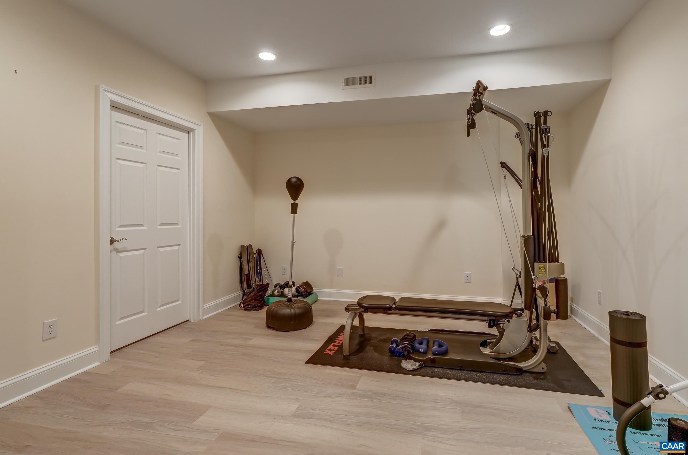Full basement features new Luxury vinyl plank flooring. Workout room