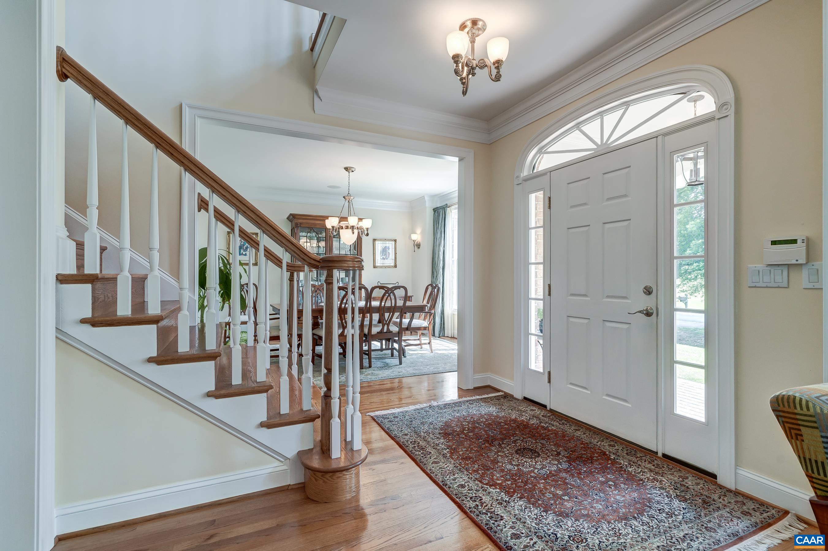 Grand foyer welcomes you into this beautiful custom home.