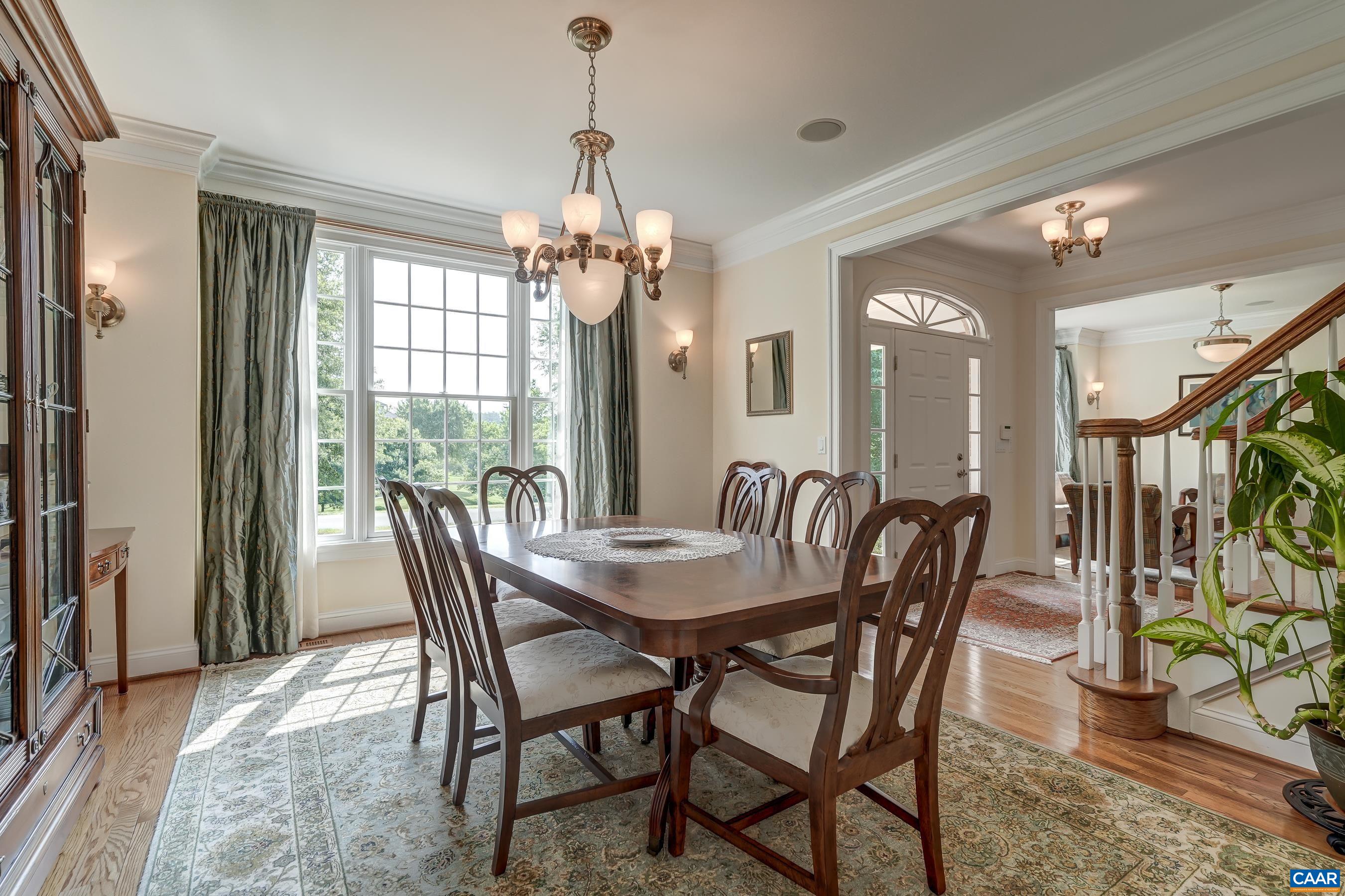 Formal dining room to the right as you enter features a large picture window, and has space for a large gathering.