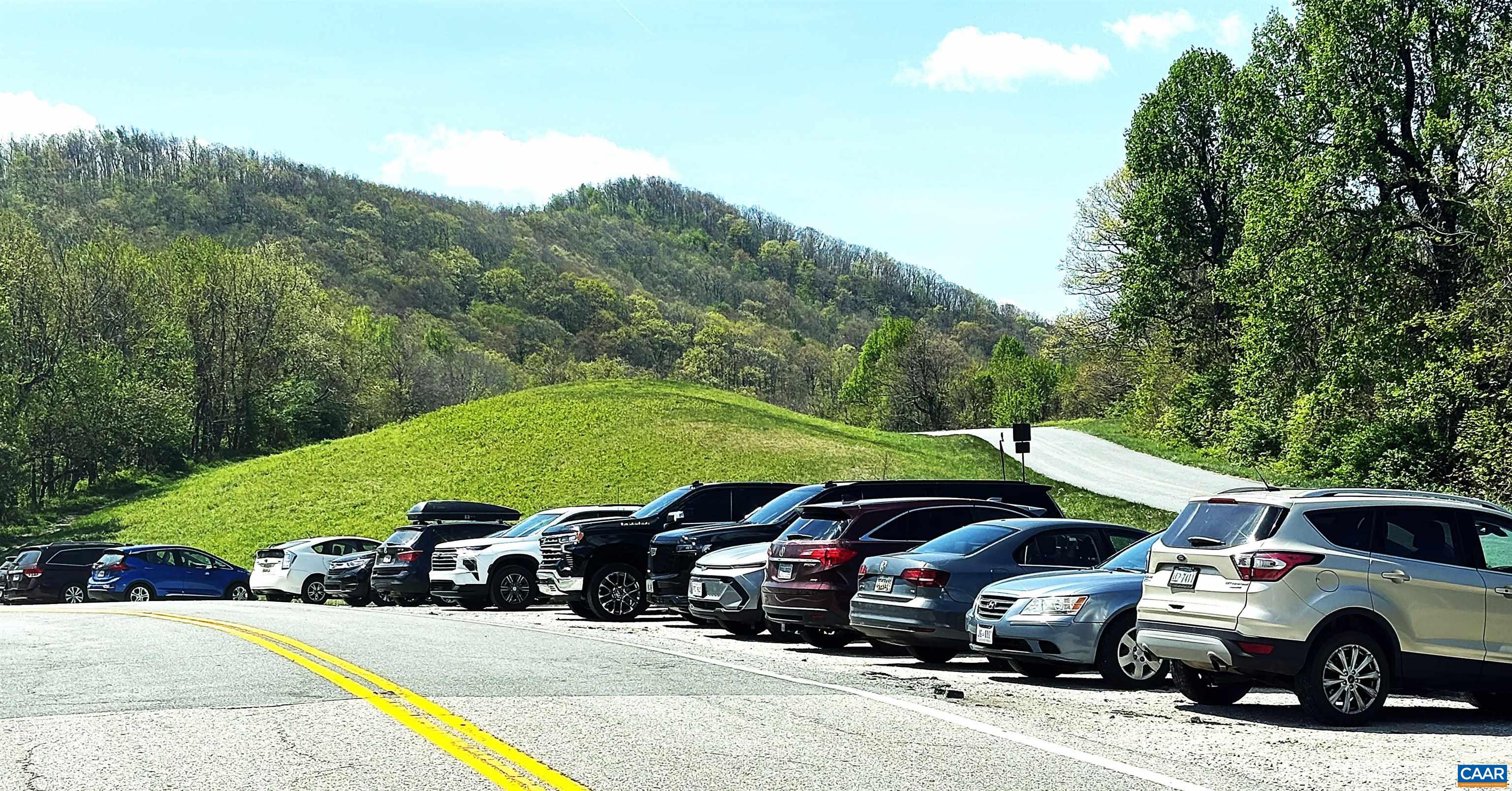 Much easier and safer to park in the parking area at the AT entrances next to the Parkway.  Walk down to property and access at the end of the guardrail off of Reeds Gap Rd.