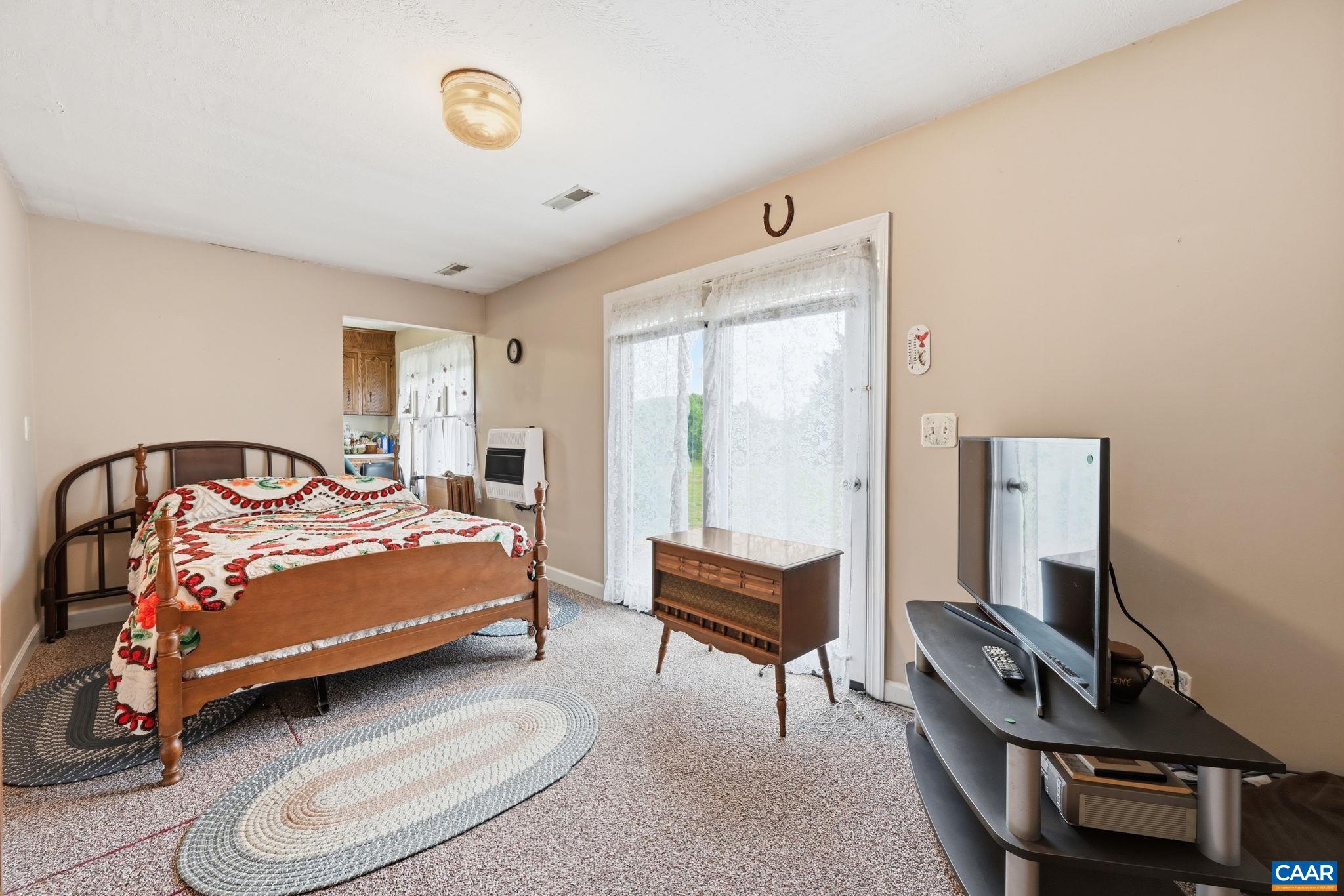 Family room used as a bedroom - used to be a sunroom until it was enclosed.