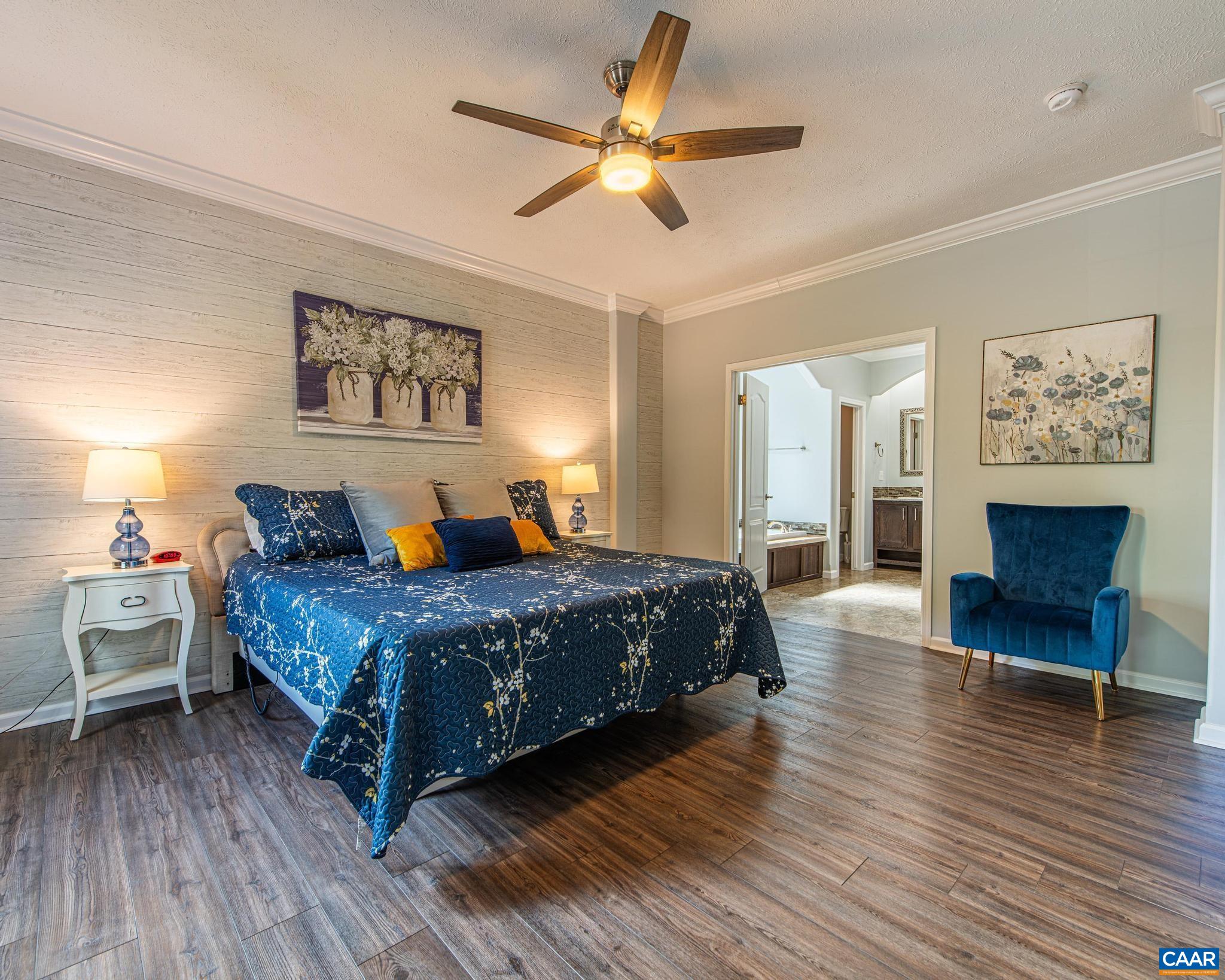 SPACIOUS & Elegantly Appointed PRIMARY SUITE w.Tall Windows, Ceiling Fan & Sitting Area