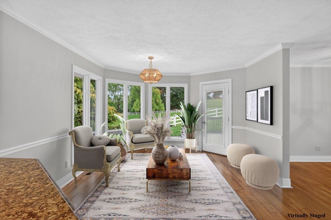 Octagonal sunroom with floor to ceiling windows.