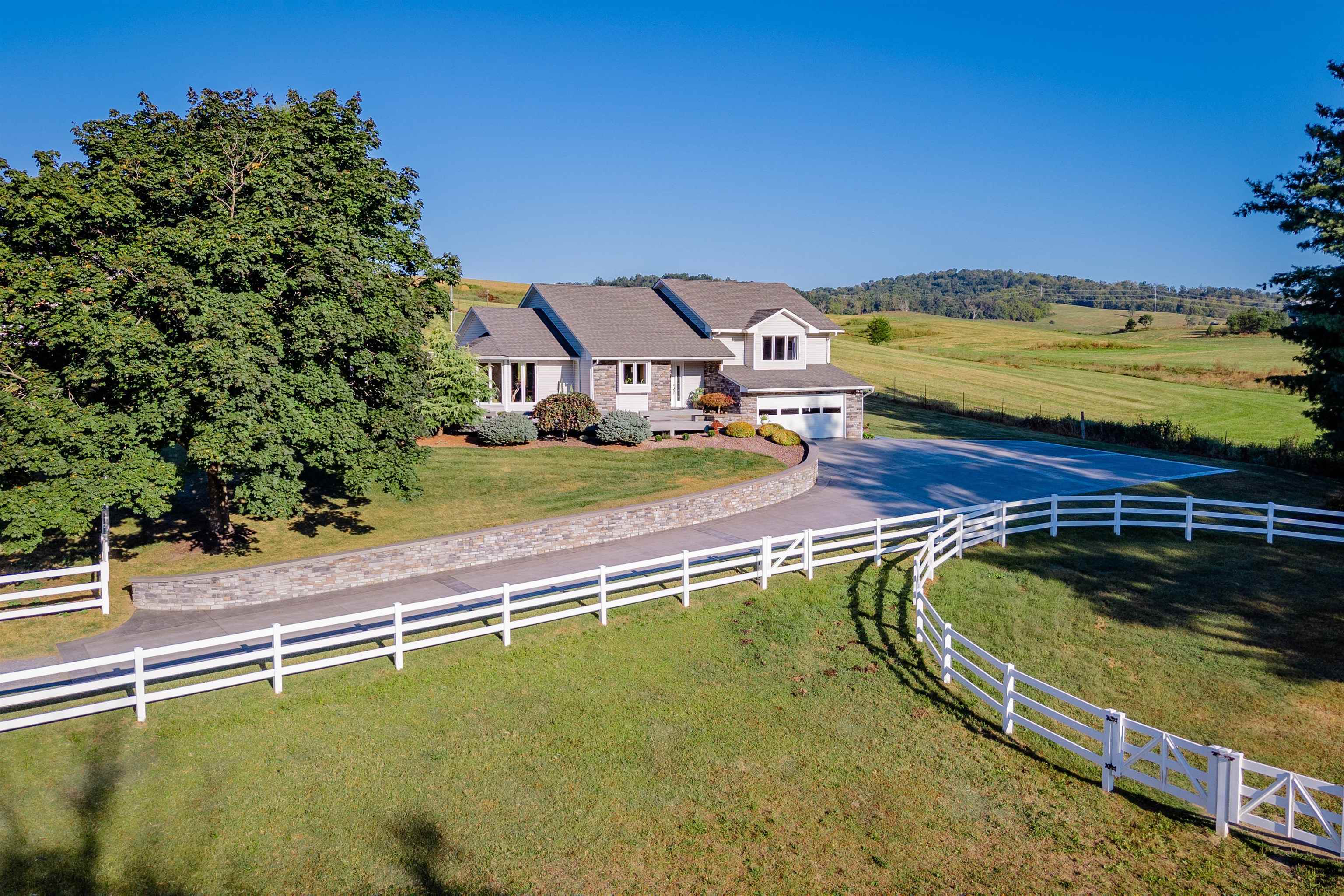 1745 +/- no maintenance Premier Vinyl install fencing with riding ring and two separate pastures.