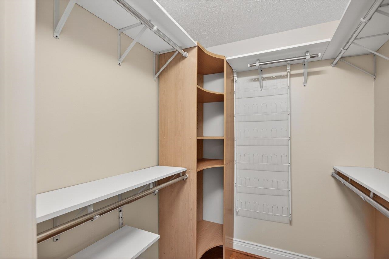 Customized primary bedroom walk-in closet