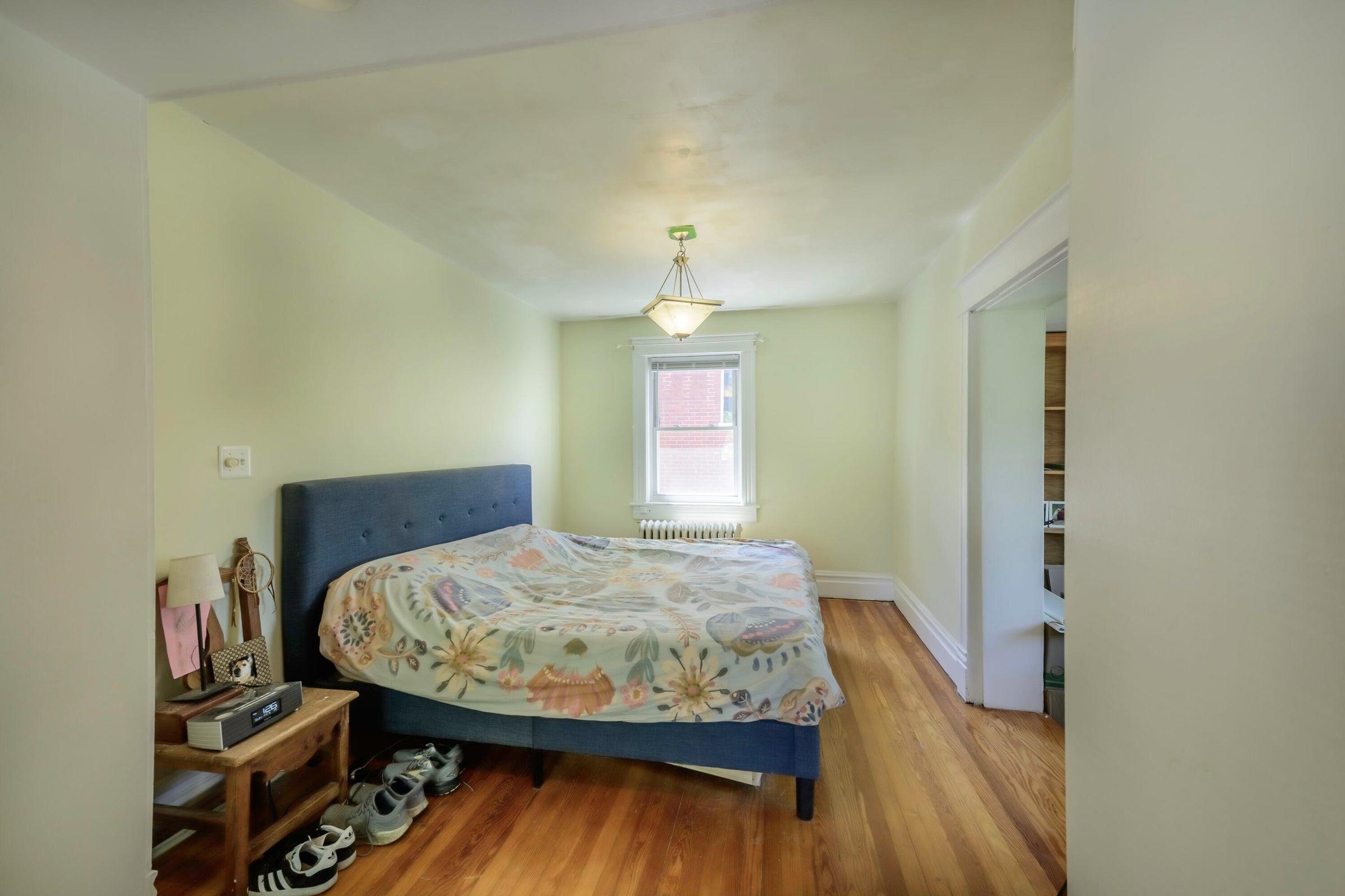 Renovated expansive Primary suite with French entry doors, complete with a full bathroom, spacious sitting area, large walk-in closet and cozy library nook or office with seasonal mountain views.