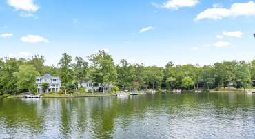 Secured bulkhead and peaceful water vistas. Enjoy outdoor living with a beautifully maintained property.
