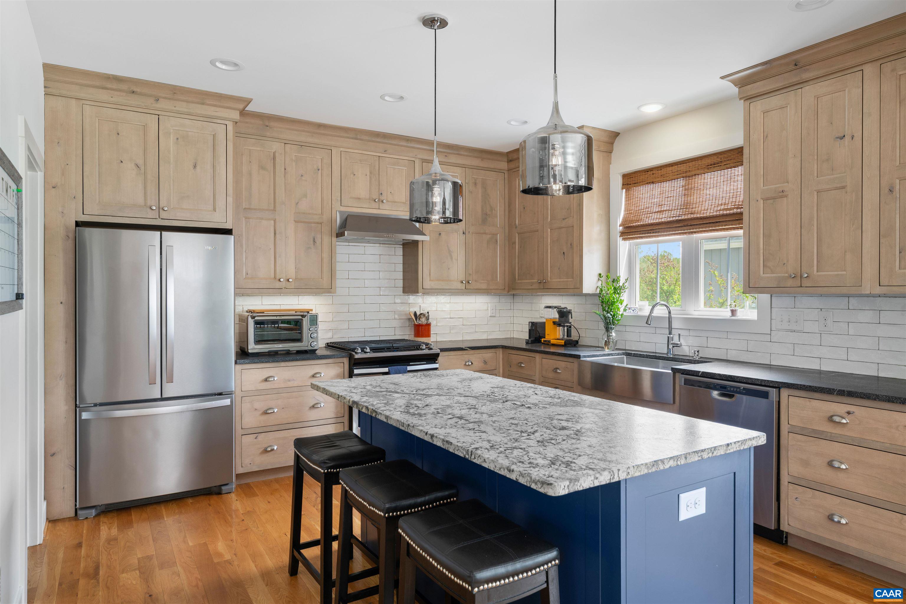 Well appointed kitchen with granite counters, walk-in pantry and center island with eating bar!