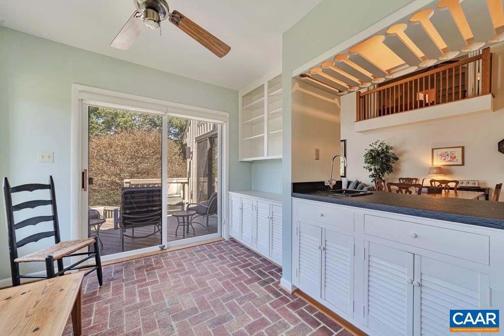 Sunroom with more cabinets and shelves