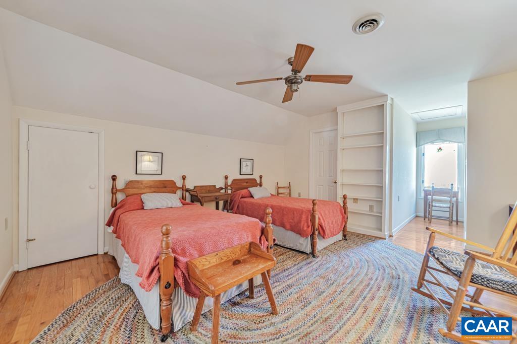 Walk in closet on the R in the dormer. Bath door on the left
