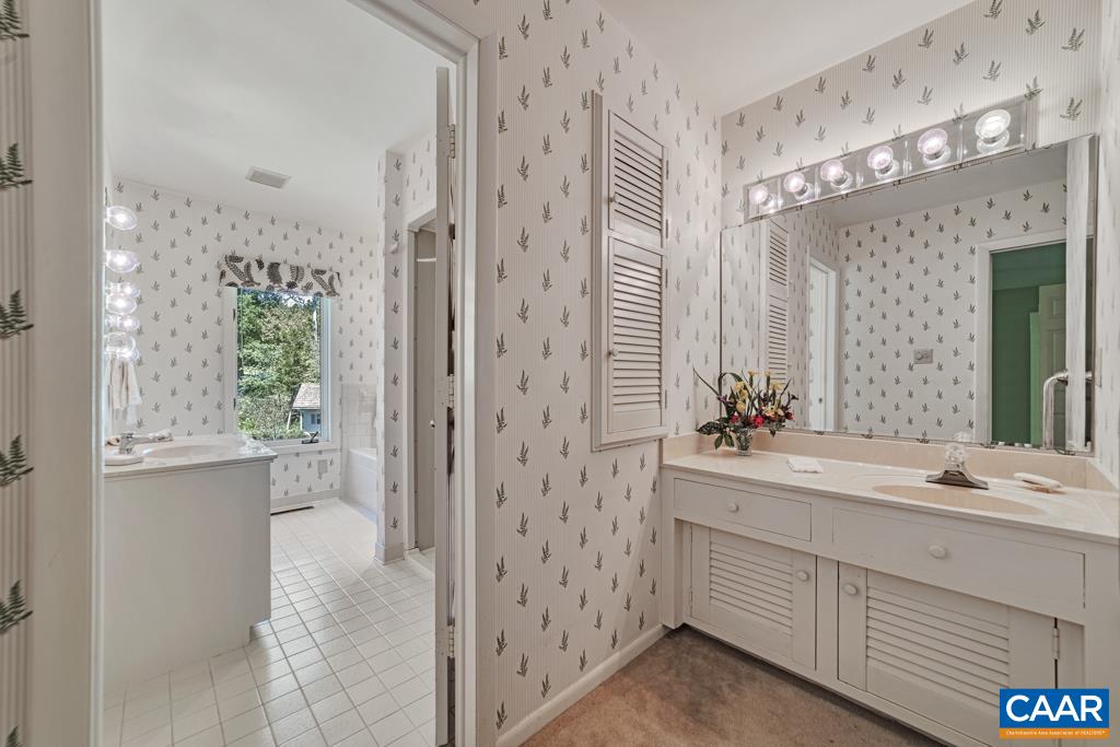 Doors close off the vanity area from the Bedroom or the Bath.