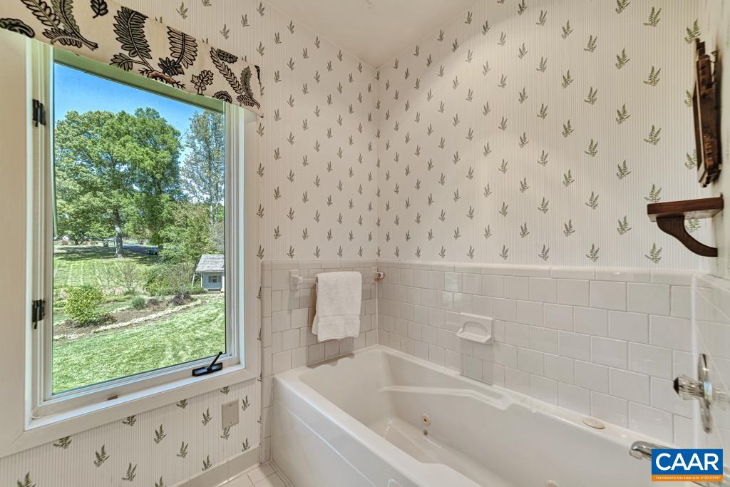 Jetted Tub and Shower. Tile floors.