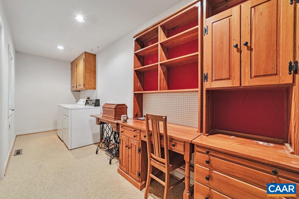 Laundry room. With a deep sink, closet and large shelf area for Pantry storage.
