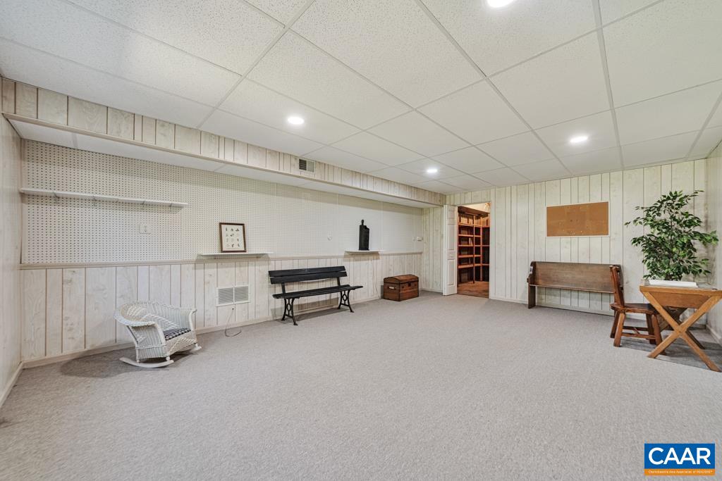 Pool table? Exercise equipment? The door in the back goes to a HUGE storage room.