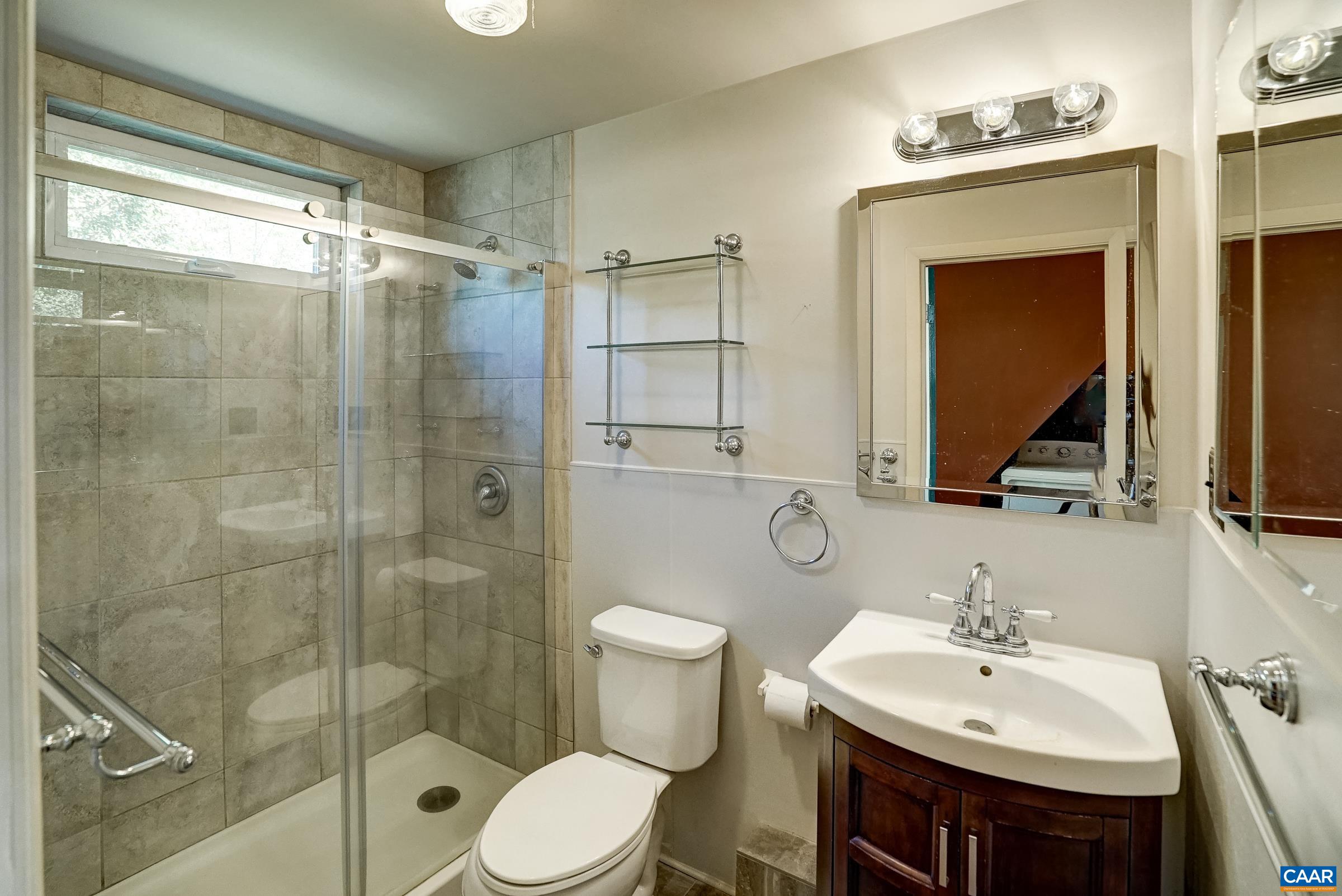 Modern bathroom with frameless glass shower.