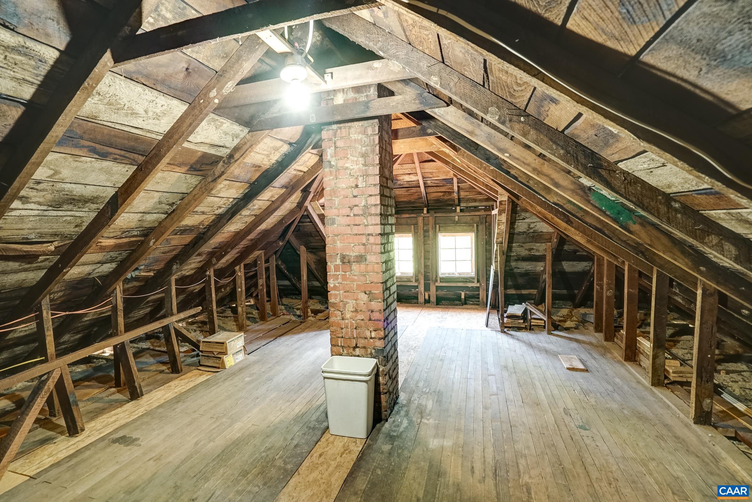 Walk up stairs lead to floored attic space - extra storage or expansion possibility!