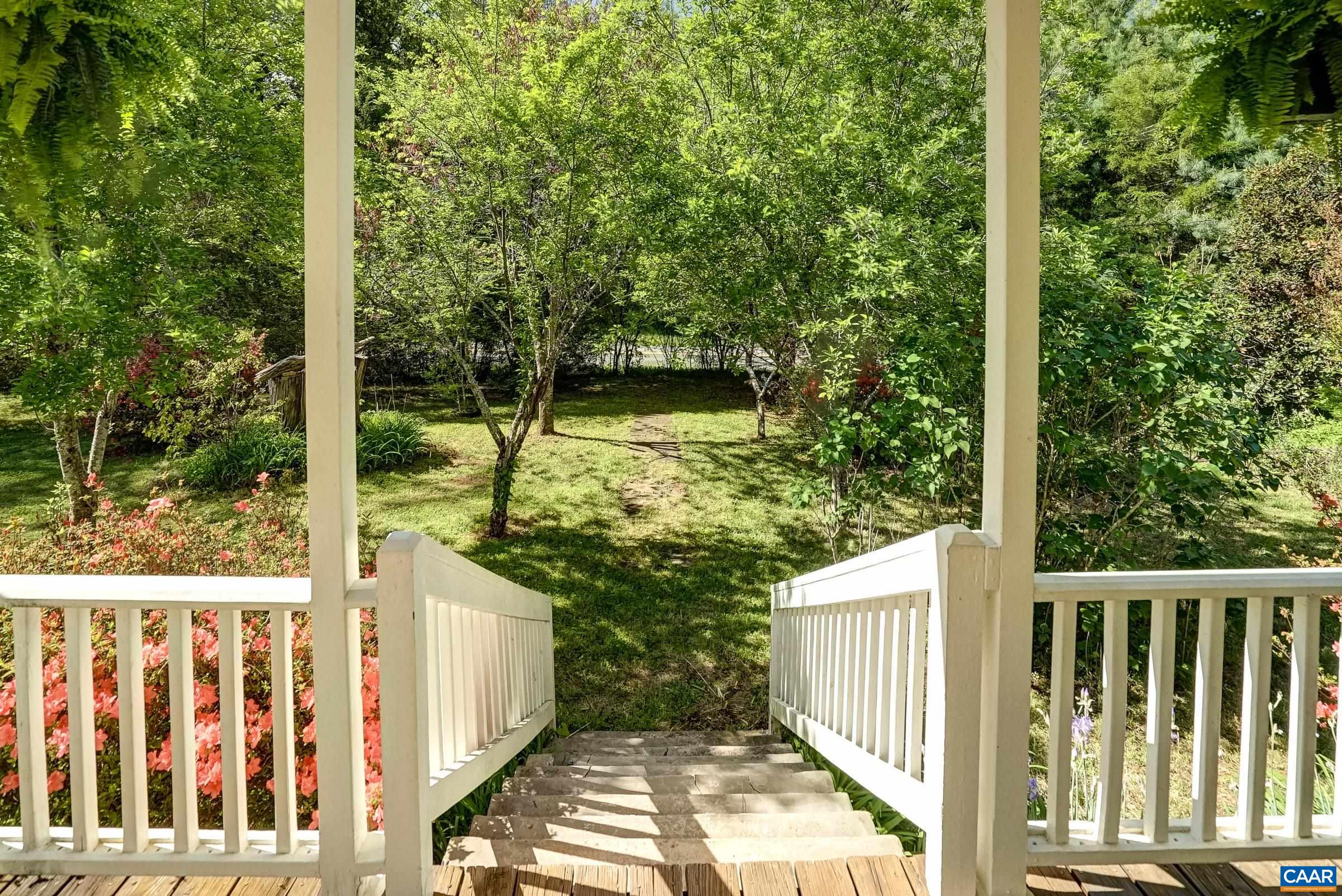 Mature landscaping, colorful plants and garden spaces.
