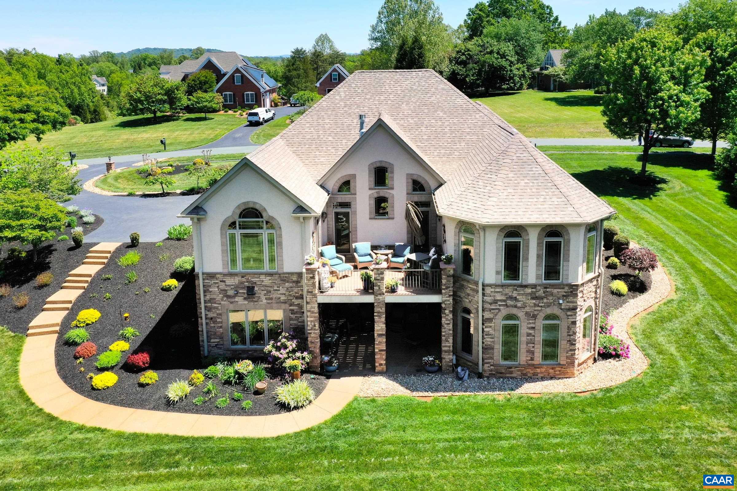 The finest in outdoor living with composite deck, meticulously maintained landscaping, water feature and container gardens.