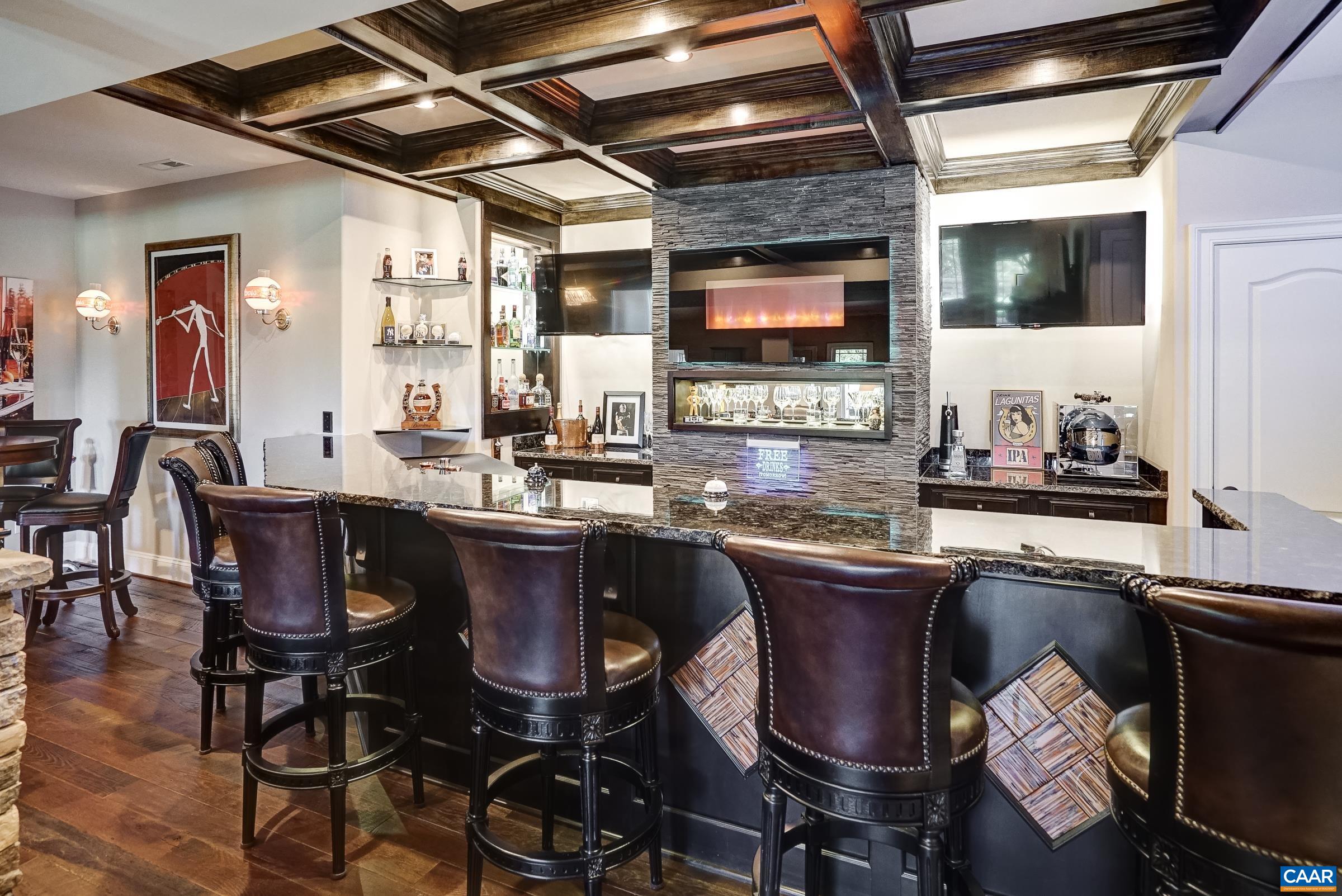 Barstools, mounted TVs and neon signs convey!