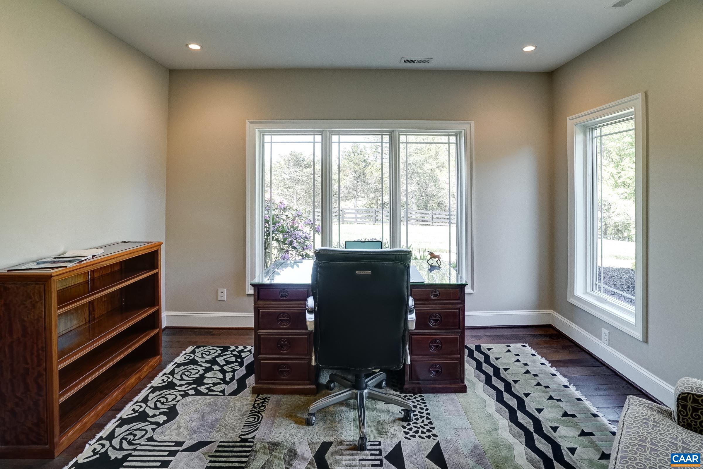 Home office with sliding pocket doors in the basement could be a fifth bedroom!