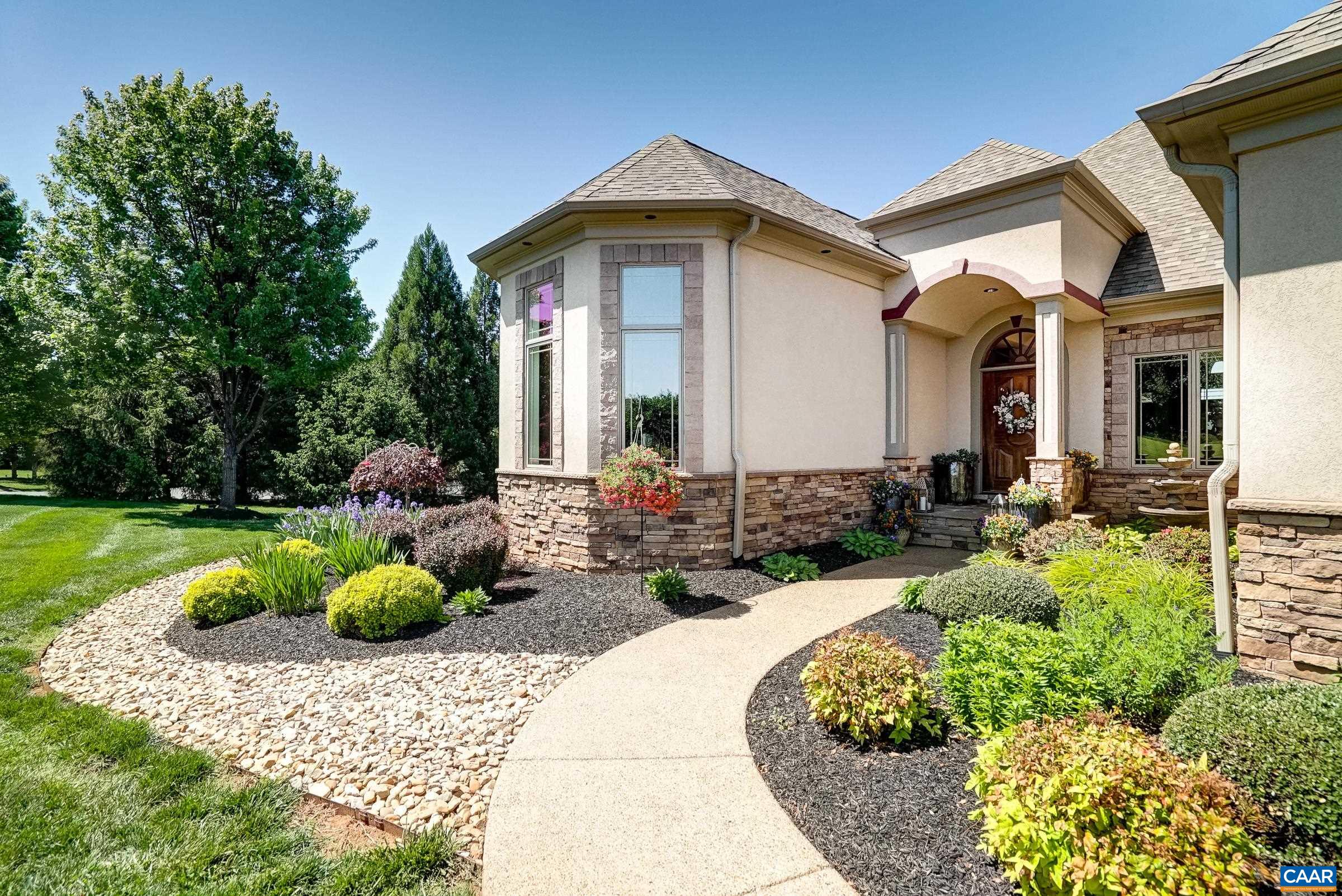 Meticulous landscaping and oversized 2 car garage too!