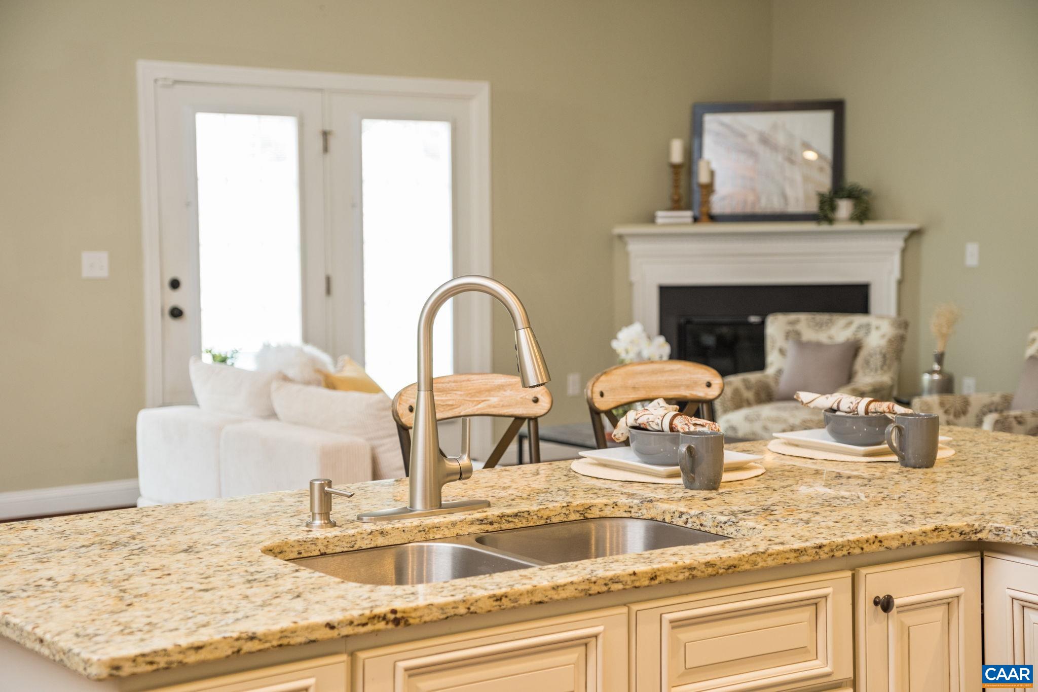 Kitchen opens to great room and dining room.