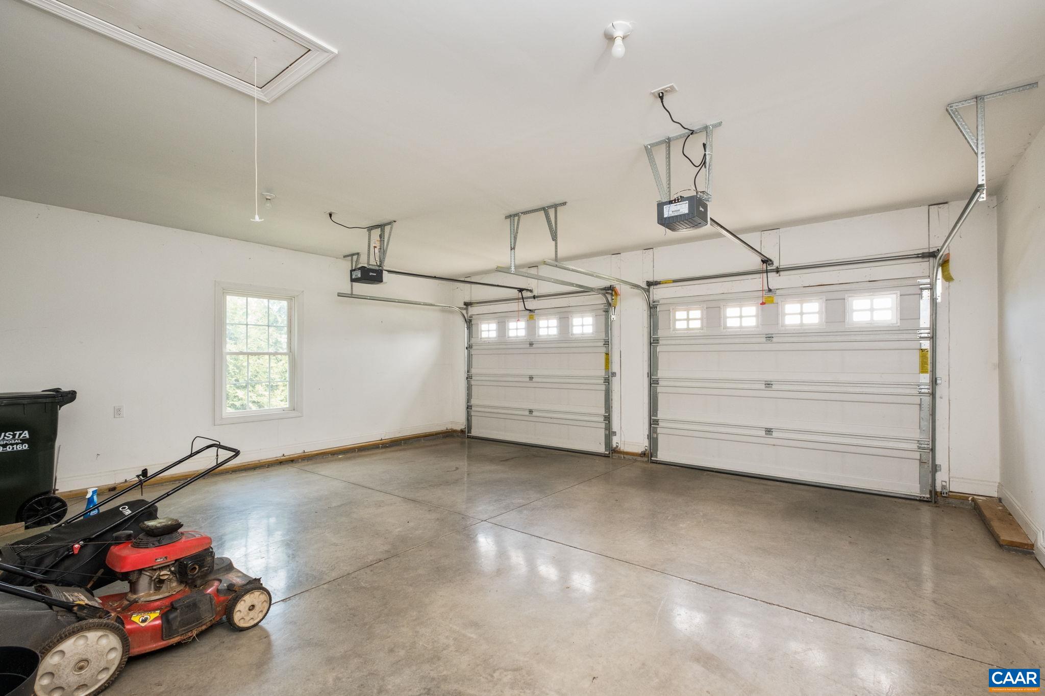 Spacious two car garage with pull down attic