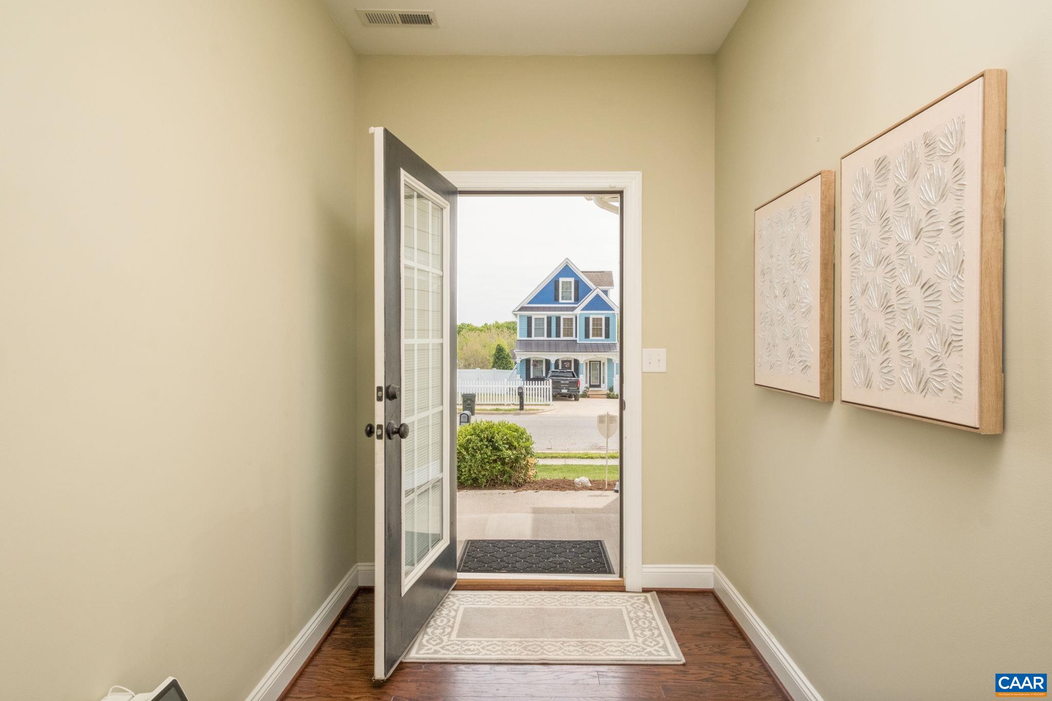 Hardwood floors and neutral paint throughout the common areas.