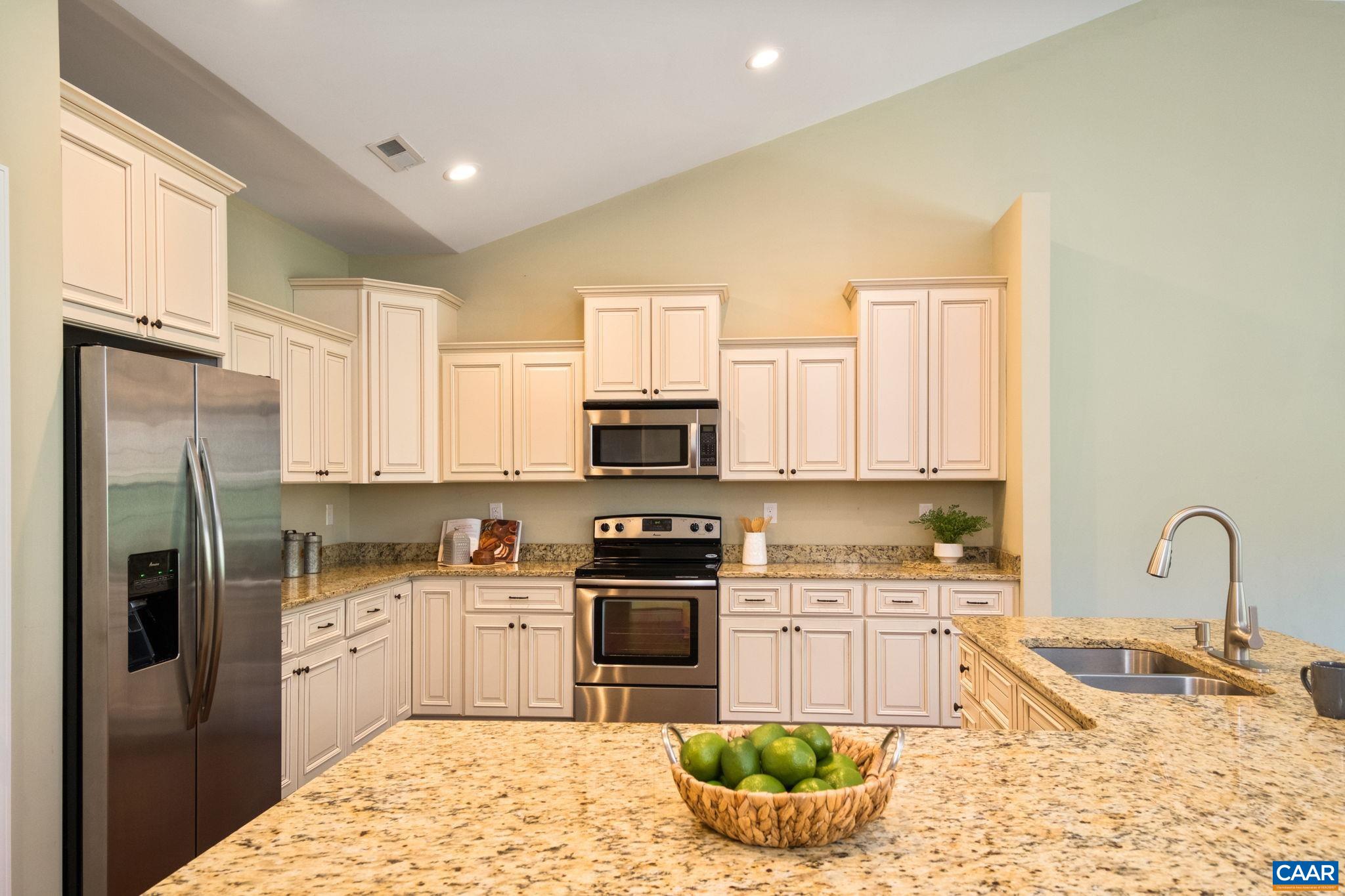 Stainless appliances, new faucet and new disposal in this modern kitchen.