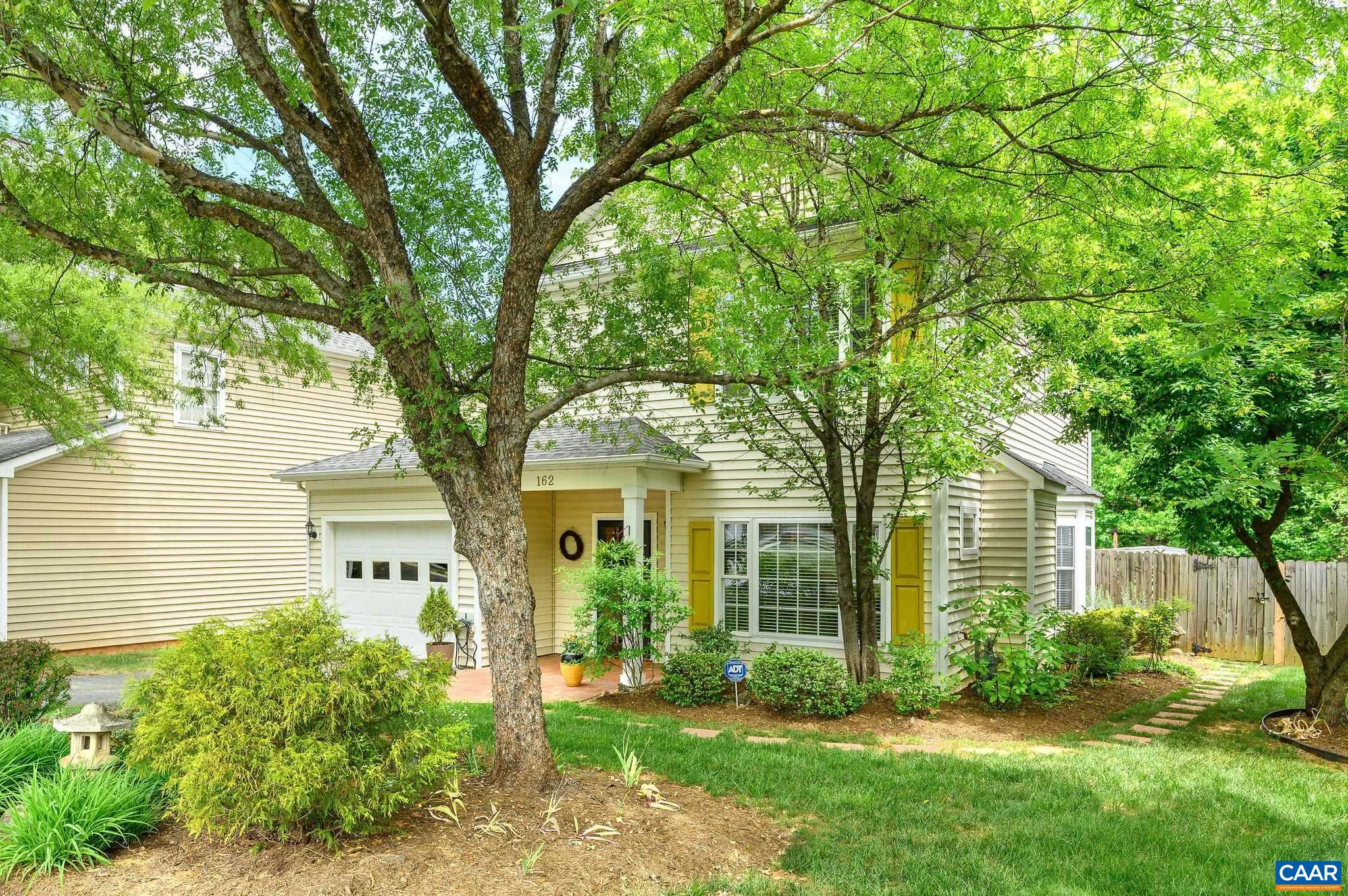 Abundant landscaping in front and rear.