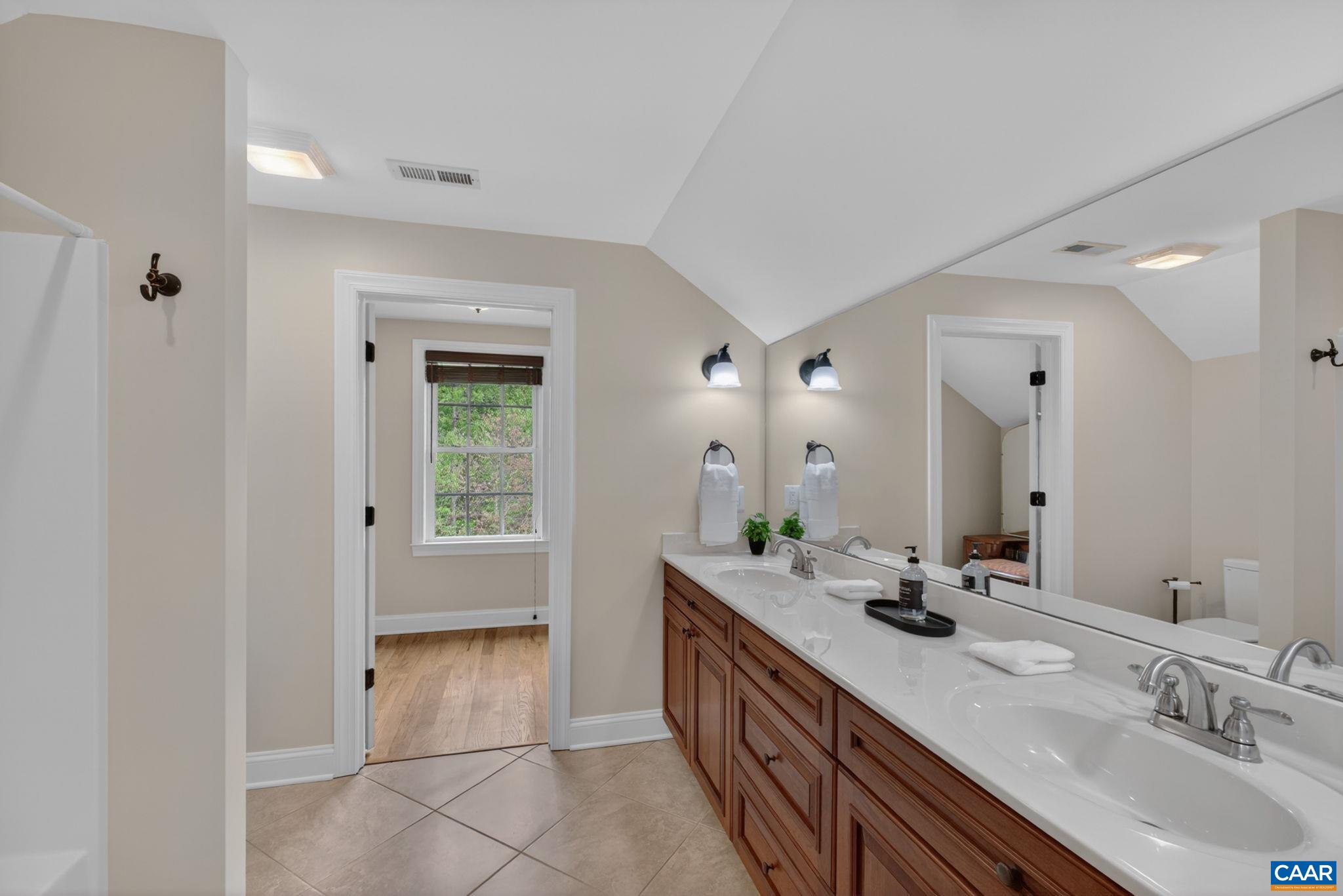 Upstairs Full Bathroom with dressing room or linen room.
