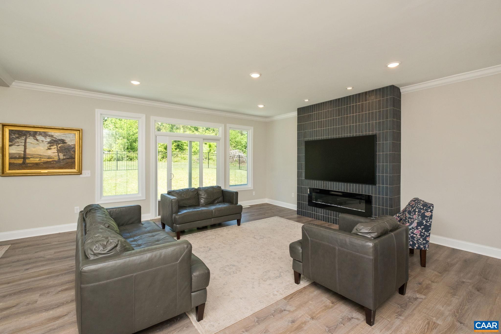 The large windows showcase the lovely outdoor views, and allow in plenty of natural light.