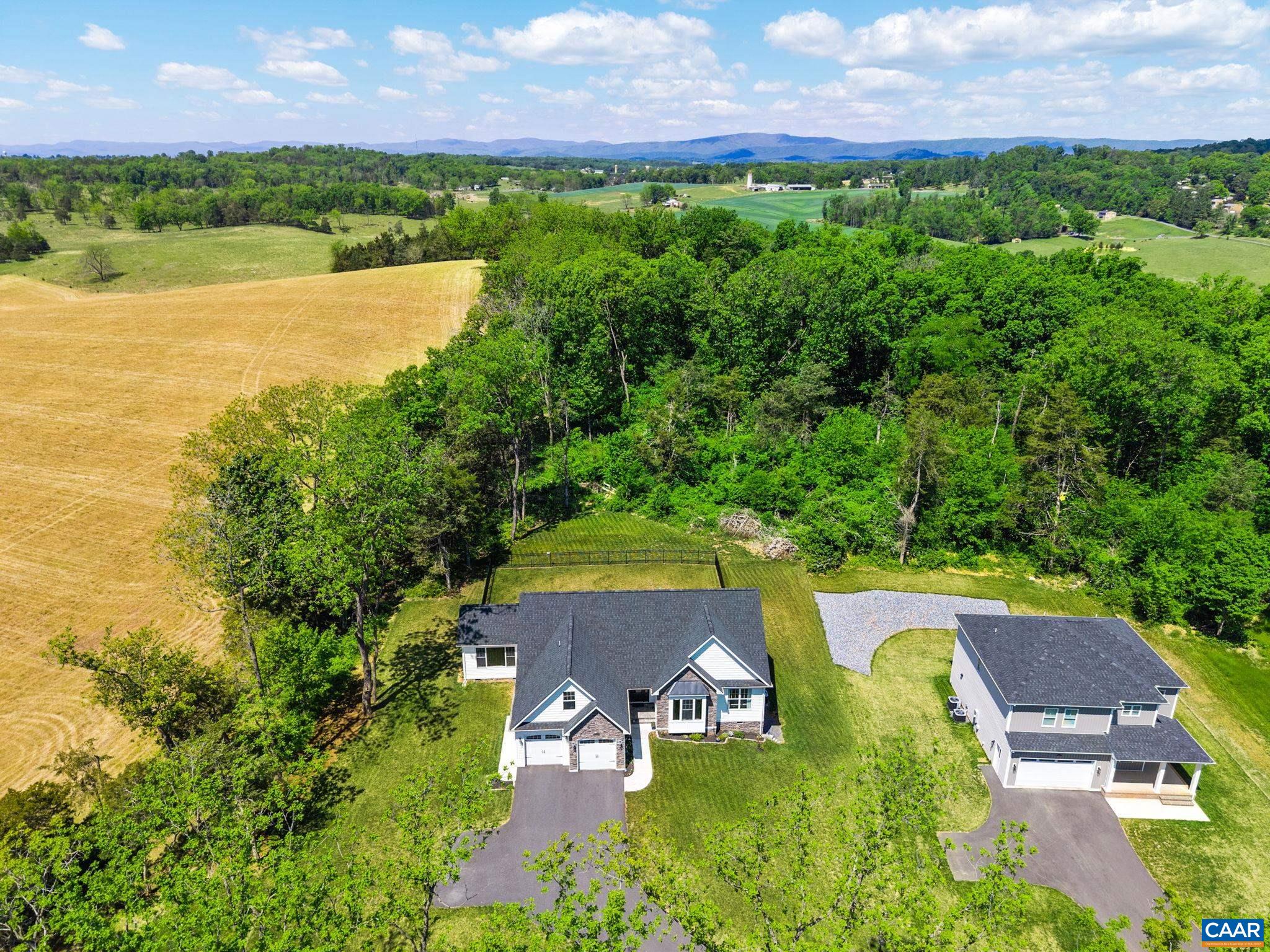 Mountain and panoramic pastoral views are visible from the home, visible from both inside and outside.